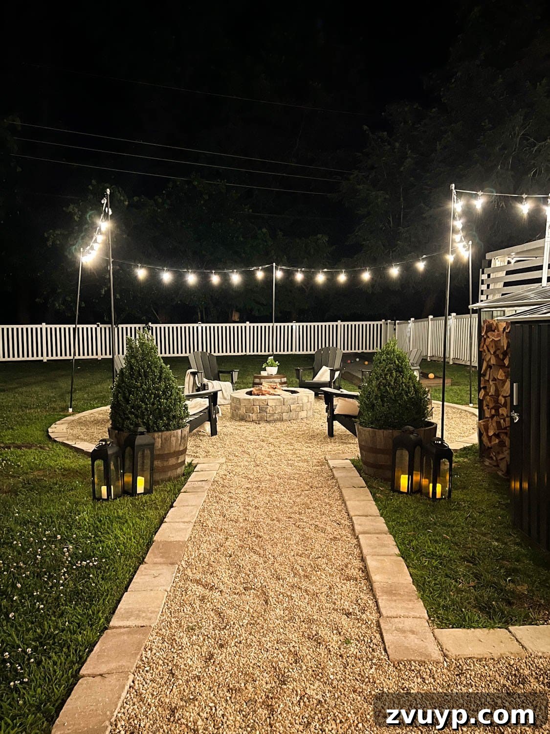 No Poles, No Problem: Creative Ways to Hang Backyard String Lights 29 hanging string lights around a fire pit with poles at night