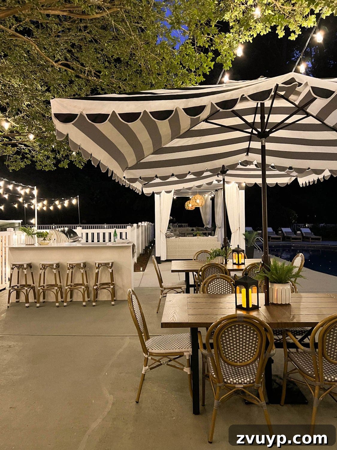 No Poles, No Problem: Creative Ways to Hang Backyard String Lights 31 outdoor dining tables and outdoor kitchen with string lights overhead