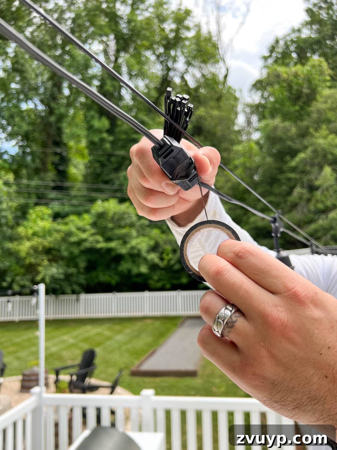 No Poles, No Problem: Creative Ways to Hang Backyard String Lights 45 wrapping light plugs with black electrical tape