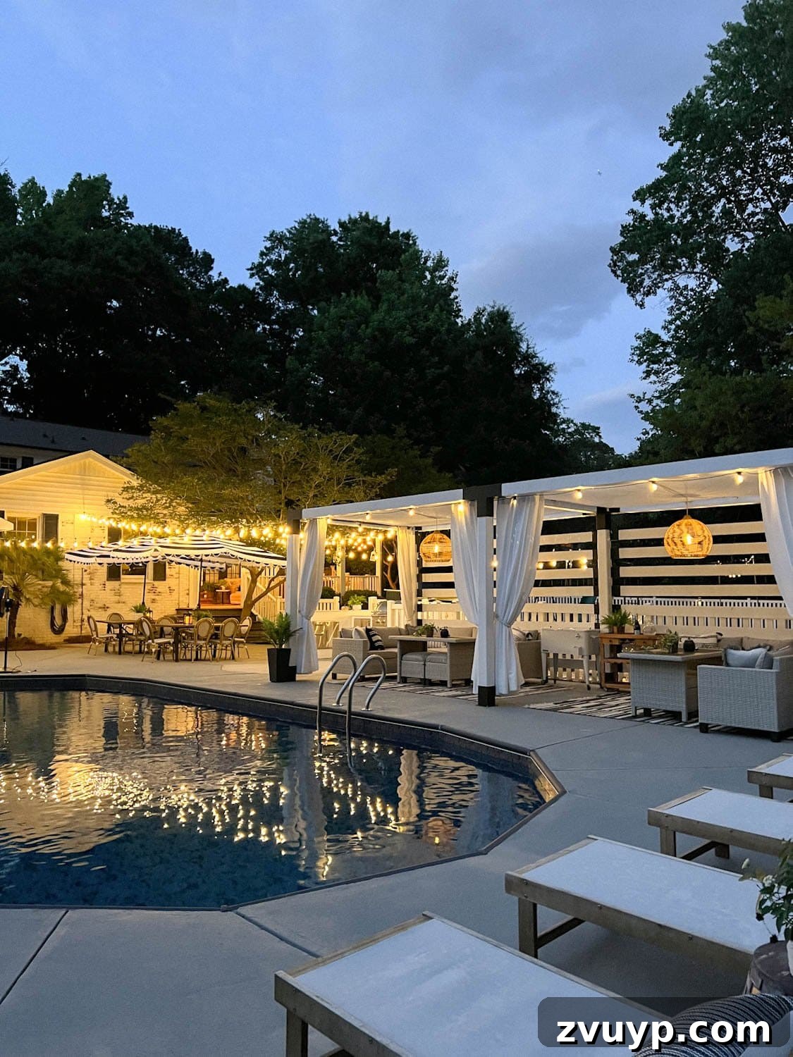 No Poles, No Problem: Creative Ways to Hang Backyard String Lights 49 string lights around a pool at night with pergola