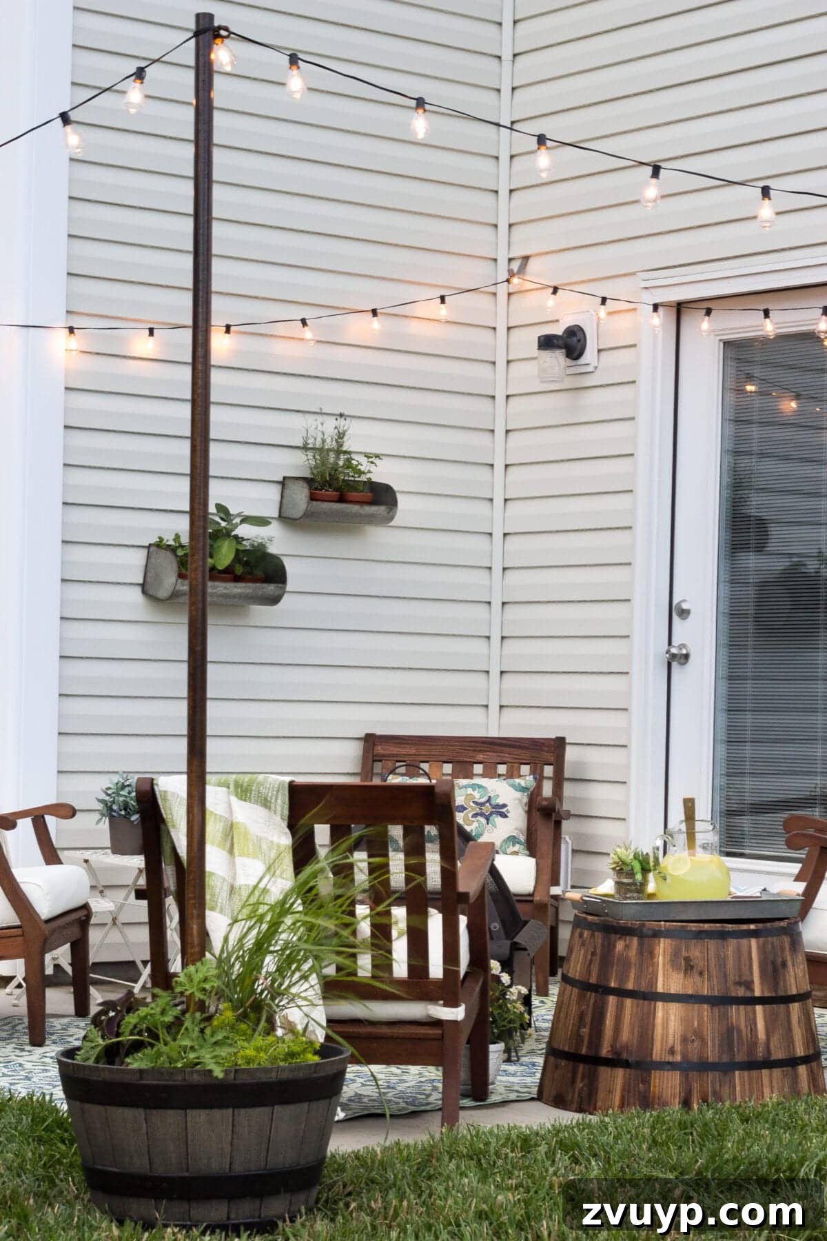 No Poles, No Problem: Creative Ways to Hang Backyard String Lights 57 string lights around a patio from siding clips and planter posts