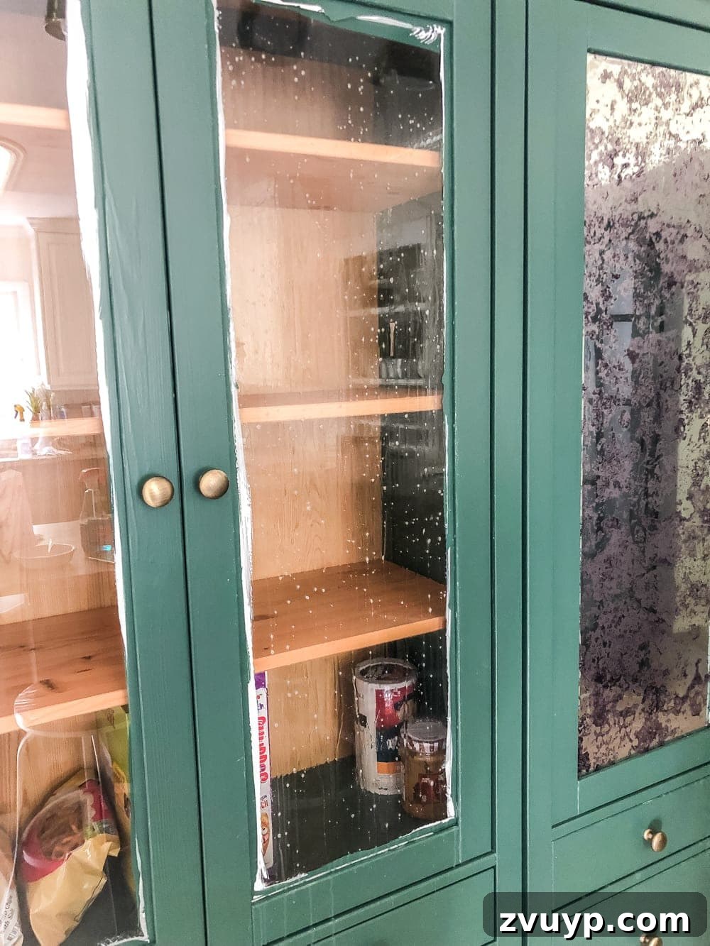 Stylish Glass on a Budget Window Film Ideas for Your Home 7 glass front cabinet sprayed with water