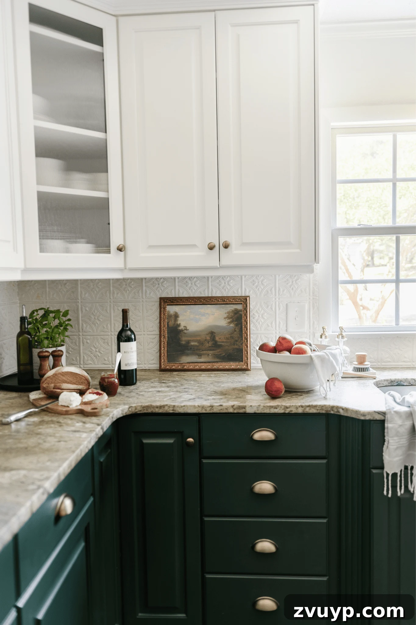 framed landscape oil painting print as kitchen art on a countertop