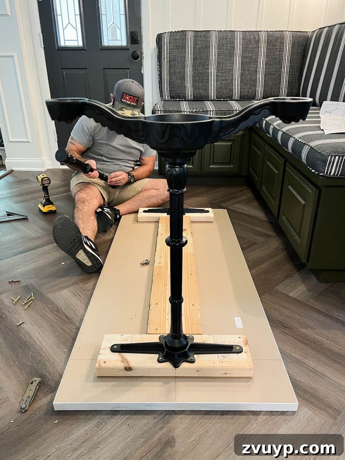 One Hour Faux Marble Dining Table Makeover 8 attaching 2x6 boards and cast iron pedestal legs underneath a countertop to make a faux marble dining table