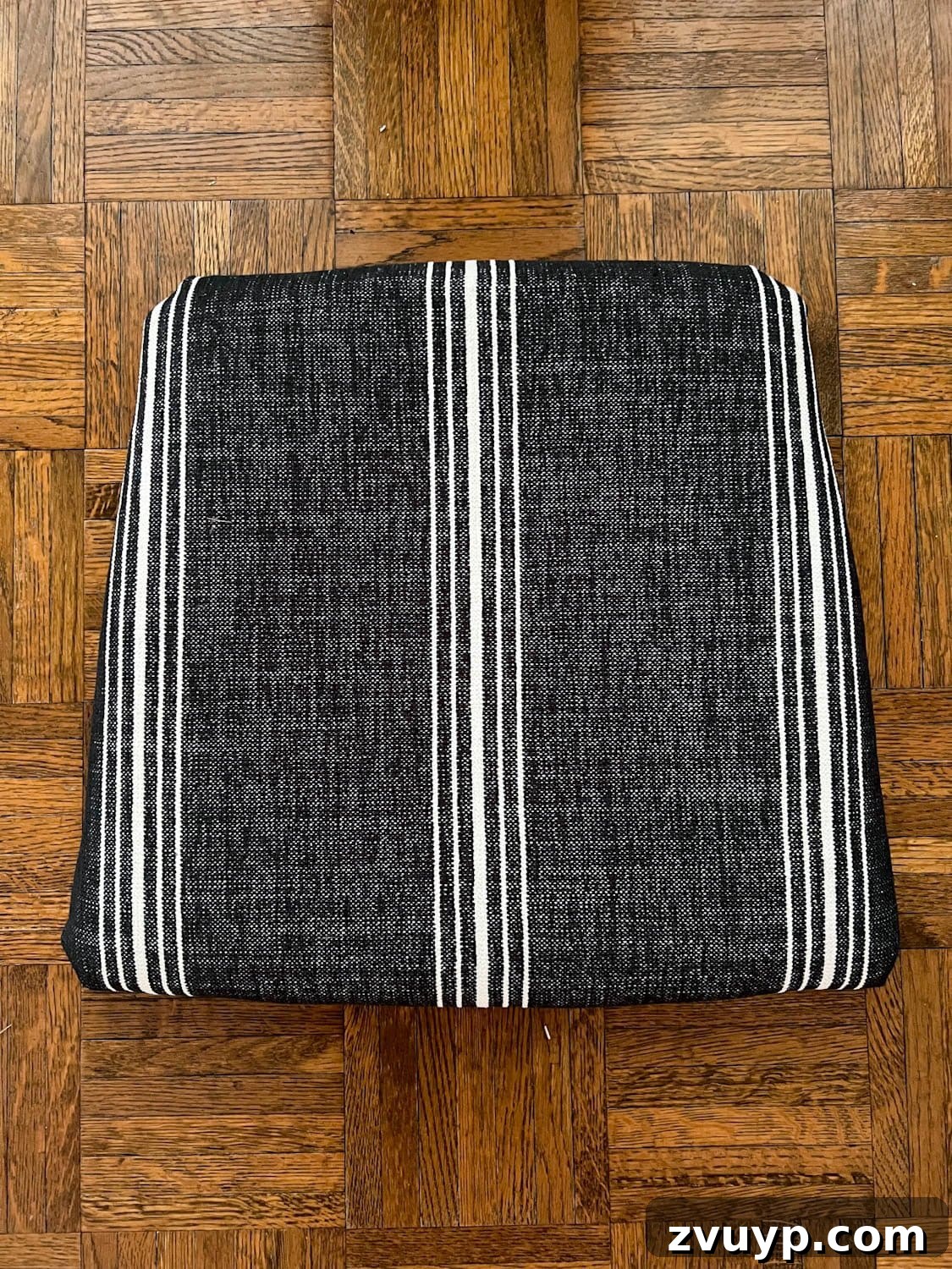 From Drab to Fab: DIY Dining Chair Reupholstery and Faux Bamboo Makeover 8 reupholstered dining chair seat with striped Crypton fabric