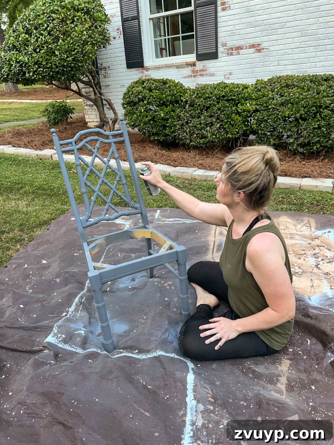 From Drab to Fab: DIY Dining Chair Reupholstery and Faux Bamboo Makeover 9 spray priming a bamboo chair