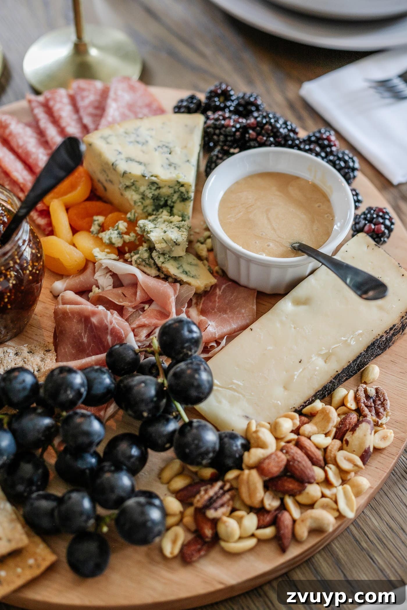 Your Go-To Guide for Flawless Table Settings, Every Time 16 a vibrant charcuterie board, expertly arranged with an assortment of meats, cheeses, crackers, jams, fresh fruit, crunchy nuts, and sweet honey