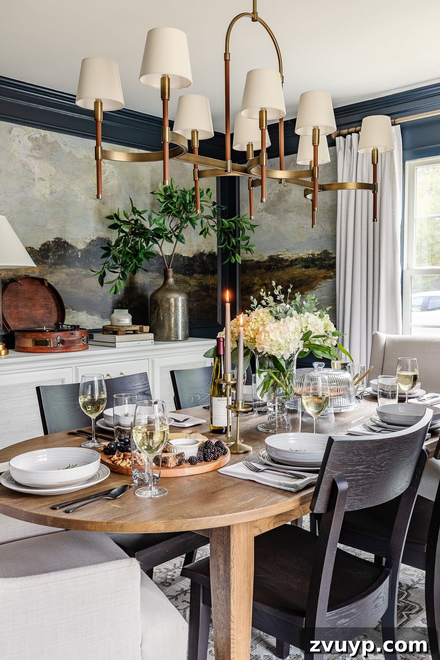Your Go-To Guide for Flawless Table Settings, Every Time 4 a dining room with a tastefully decorated dinner table featuring a vibrant summer centerpiece, neutral dinnerware, and a tempting charcuterie board
