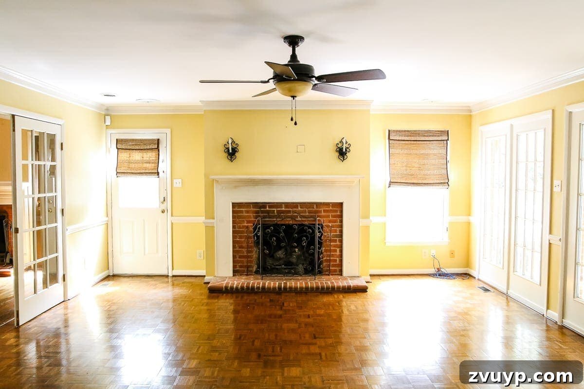 Our Home's Incredible 5-Year Transformation Tour 31 before living room with bland yellow and white decor, appearing uninspired and dated