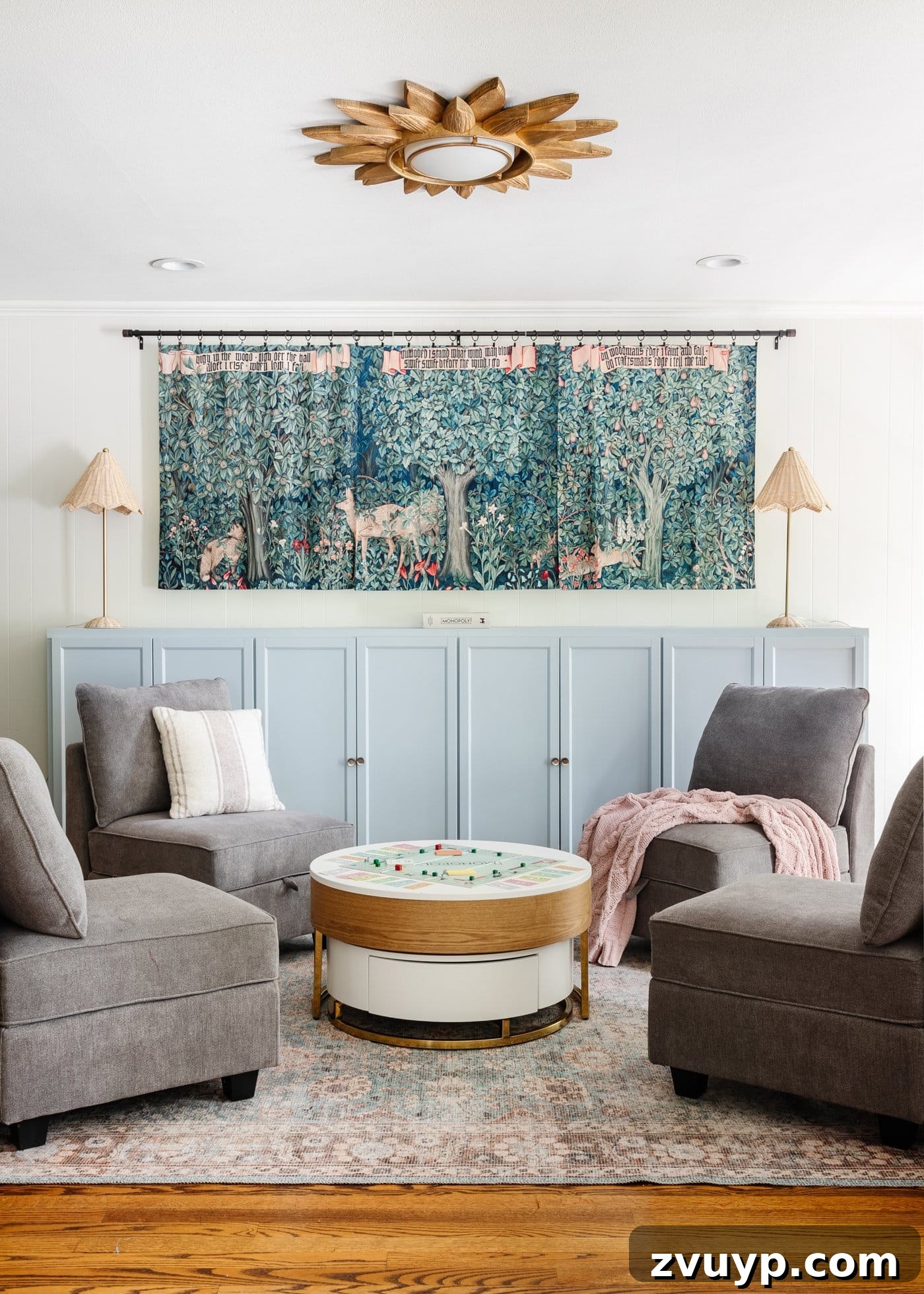 Our Home's Incredible 5-Year Transformation Tour 39 bright white playroom featuring a delightful light blue mantel, practical toy storage cabinets, a captivating William Morris tapestry, and versatile storage furniture, creating an organized and inspiring space for children