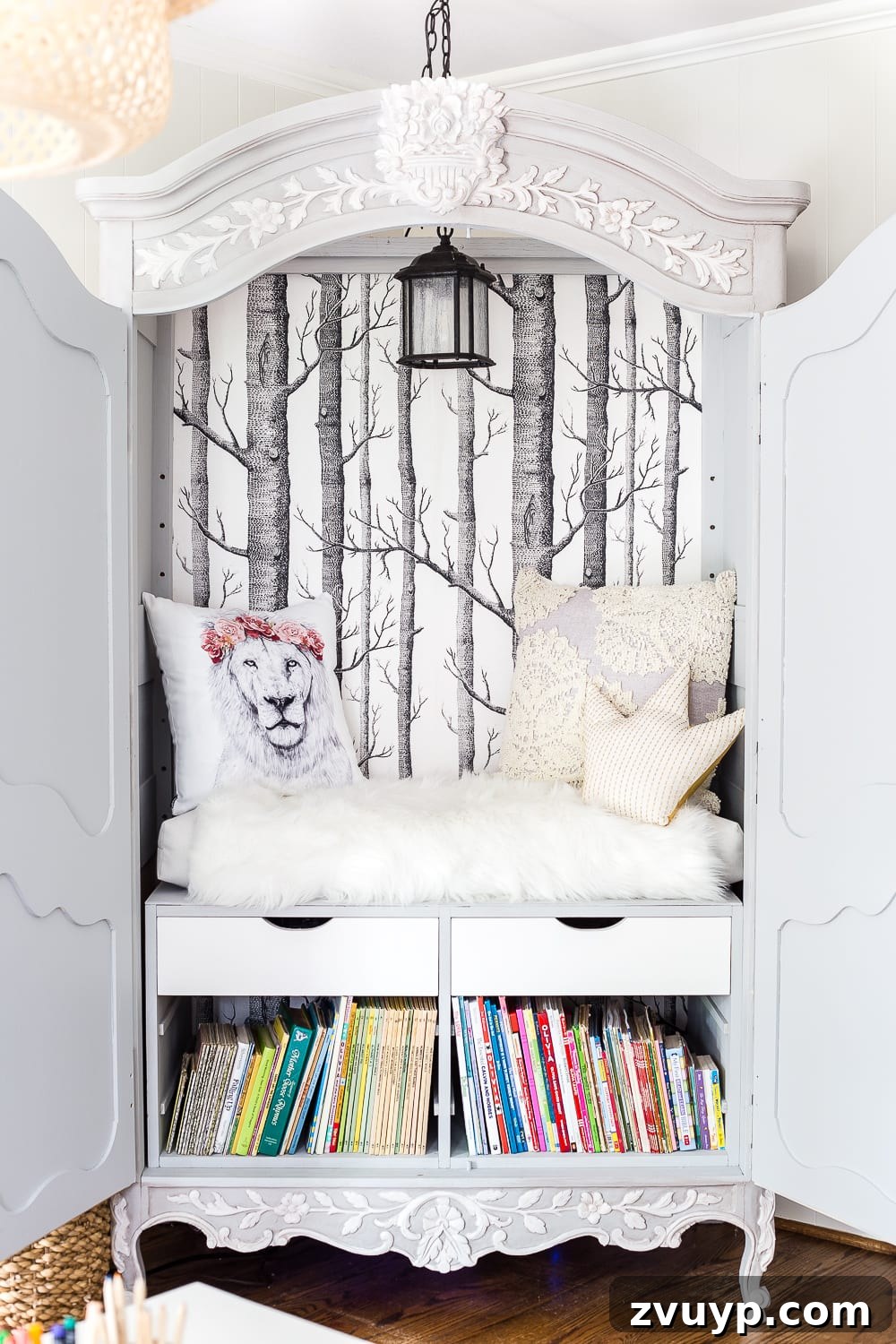 Our Home's Incredible 5-Year Transformation Tour 40 magical Narnia wardrobe reading nook crafted from a thrifted armoire, featuring enchanting forest wallpaper, a whimsical lantern light, and a cozy lion throw pillow, creating a perfect hideaway for imagination