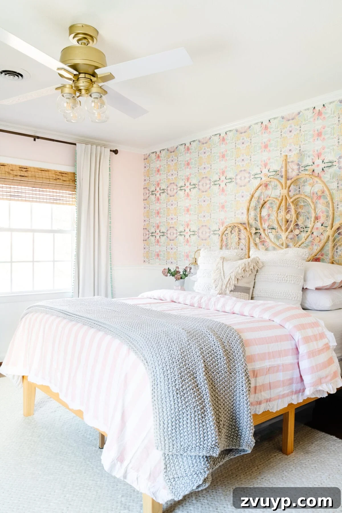 Our Home's Incredible 5-Year Transformation Tour 52 charming blush pink girl's room with a soft cream rug, a functional white homework desk, a stylish rattan bed, and personalized boho decor, creating a cozy and evolving sanctuary