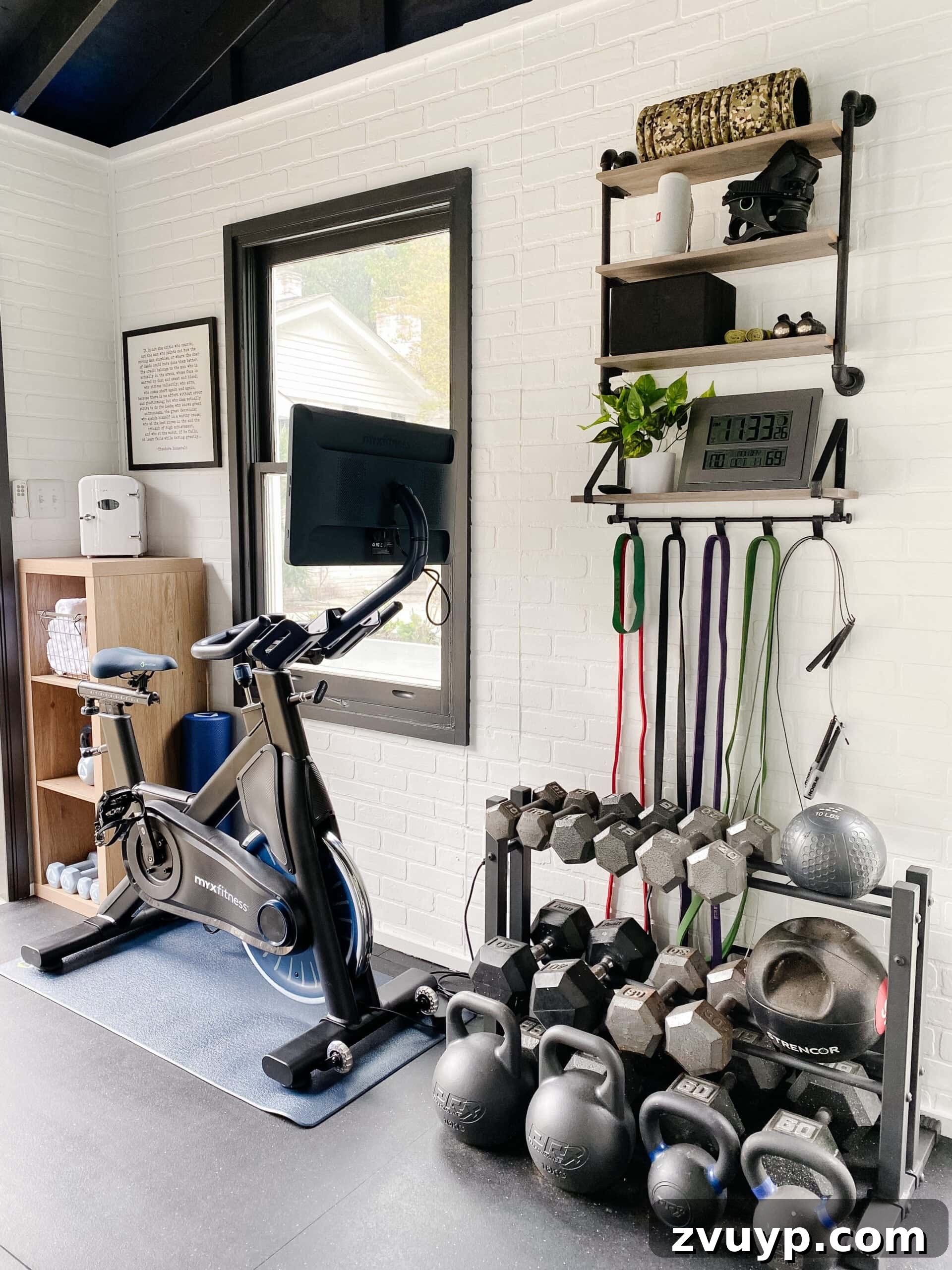 Our Home's Incredible 5-Year Transformation Tour 79 invigorating home gym created from a backyard shed, featuring striking faux brick walls, a dramatic black vaulted ceiling, and durable black rubber floors, ideal for intense workouts