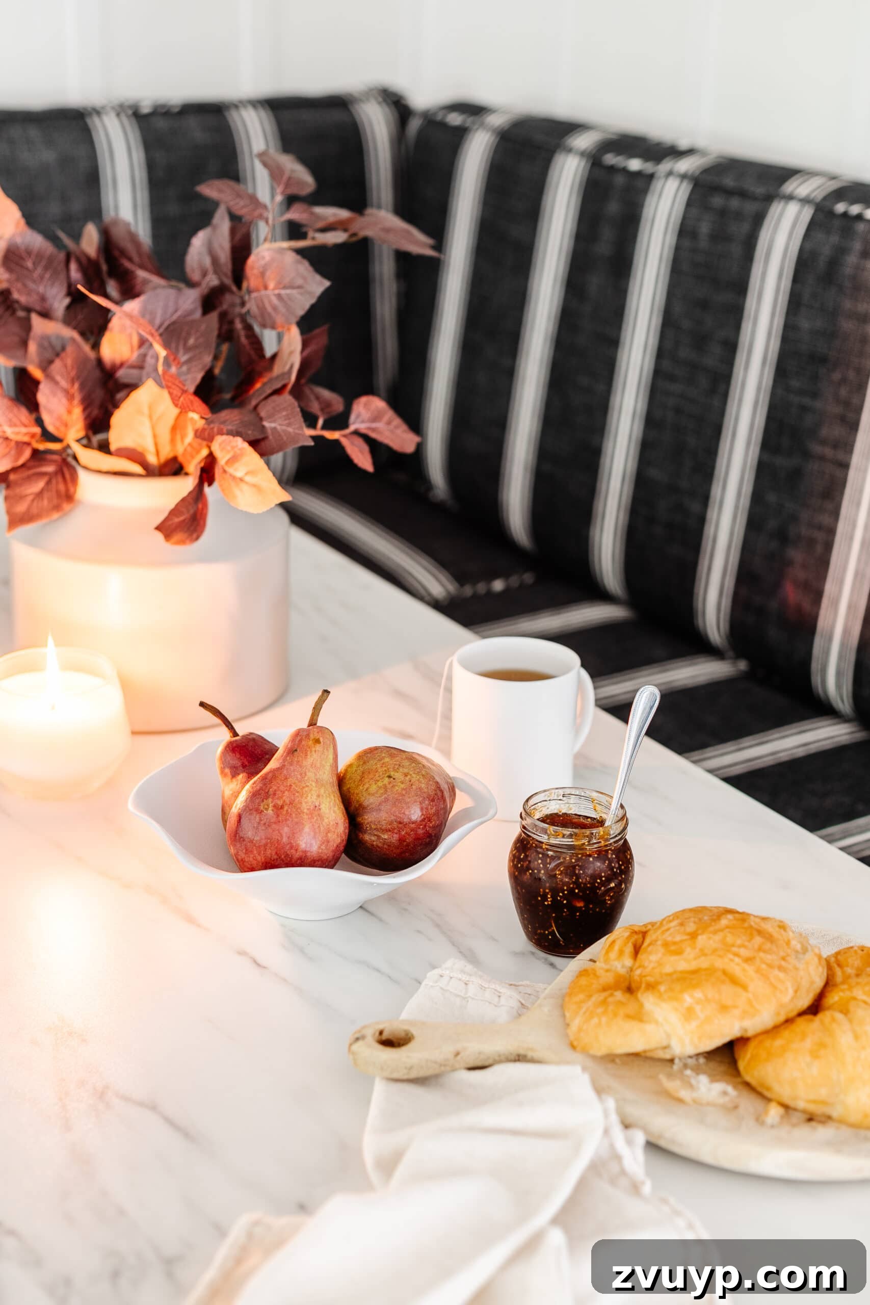 Scalloped Bowl Trend: White Spray Paint Thrift Flip 6 Stylish scalloped bowl on a dining table, filled with fresh pears alongside jam and croissants, perfect for brunch decor.