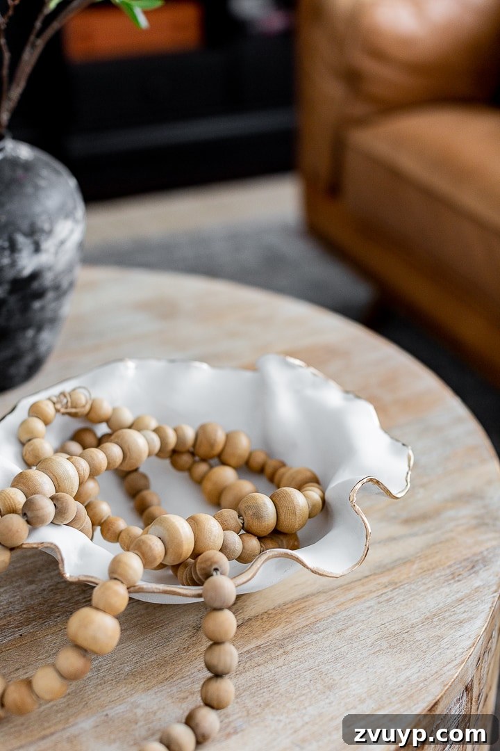 Scalloped Bowl Trend: White Spray Paint Thrift Flip 7 DIY scalloped bowl made out of air-dry clay with a gold rim, showcasing creative crafting for home decor.