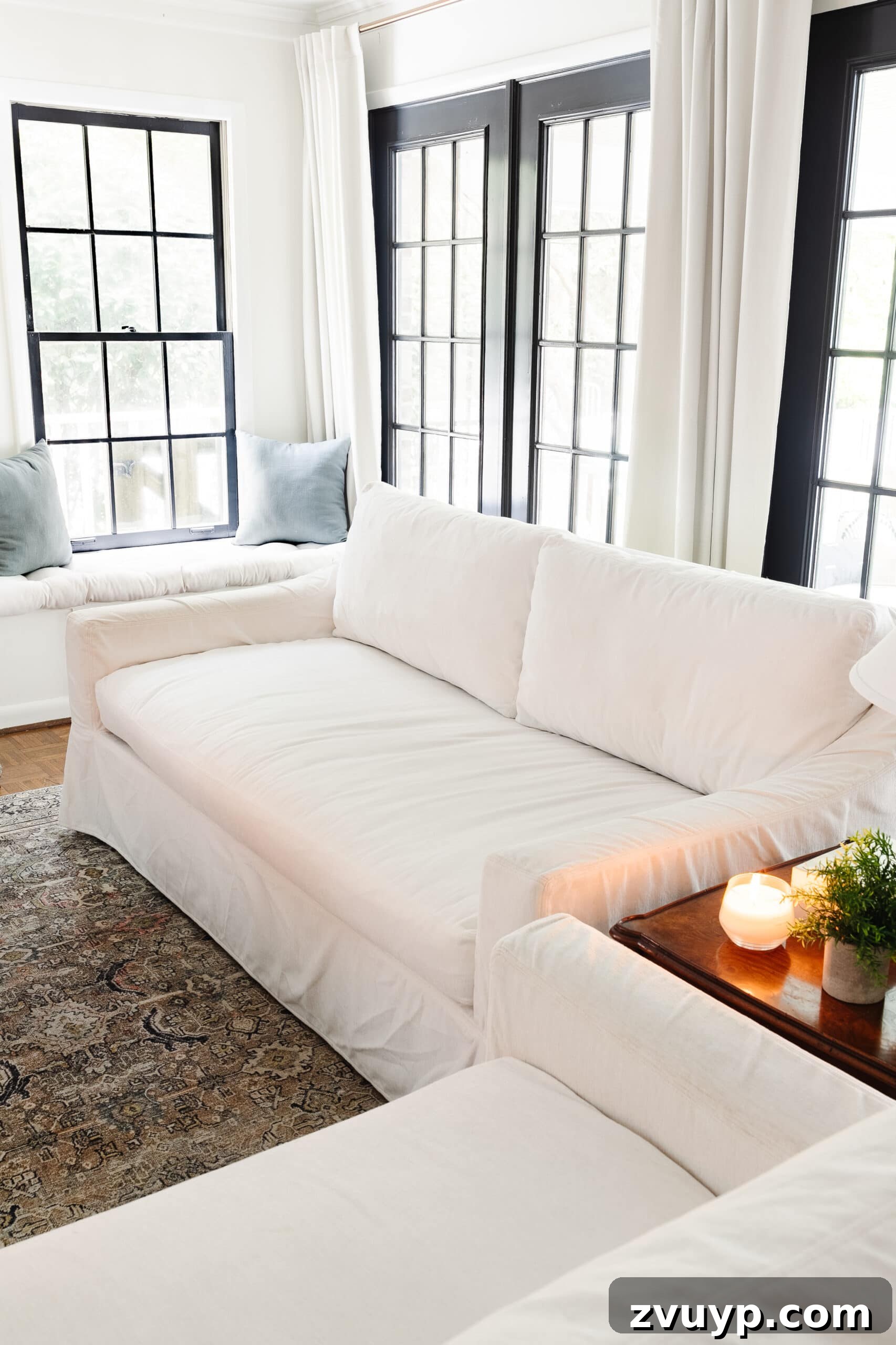 Revive Your Fabric Furniture The Ultimate Upholstery Deep Clean 16 A pristine white clean couch in a bright living room, showcasing the success of the cleaning method.