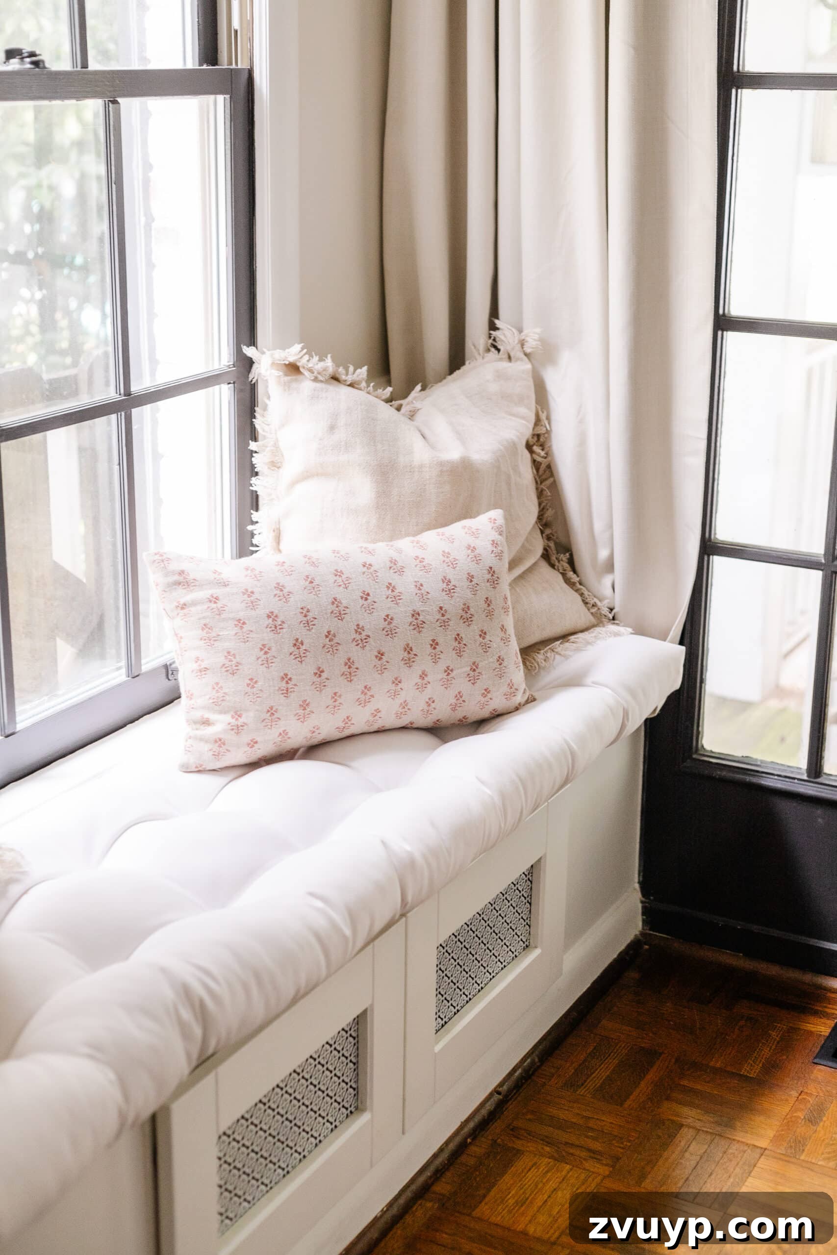window seat in a living room with neutral fall pillows