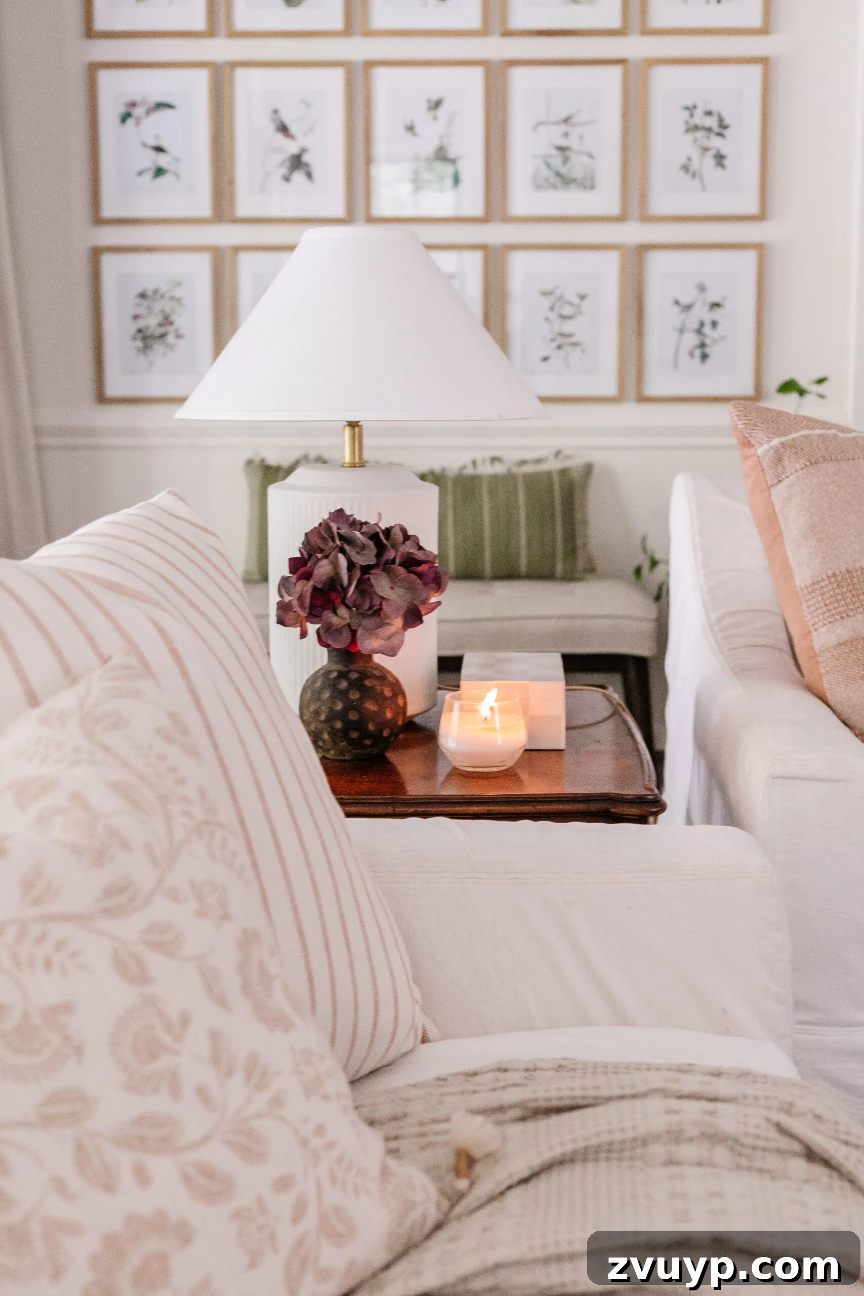 fall living room decor ideas on an end table with vase of fall hydrangea and candle