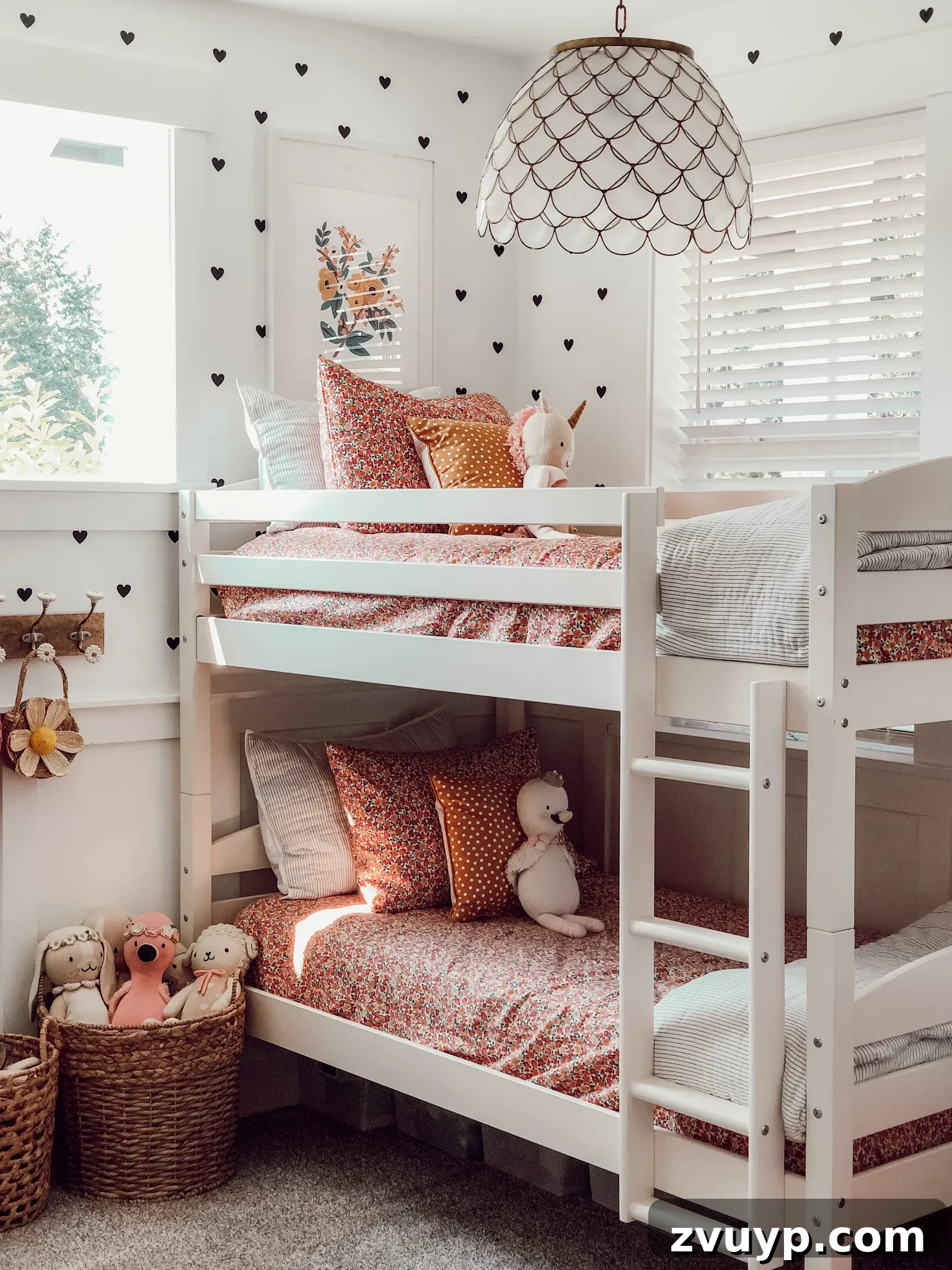 Smart Bunk Beds to Maximize Small Bedrooms 14 Simple feminine bedding with vibrant colors contrasting white walls, making the bunk bed a playful focal point in a small bedroom.