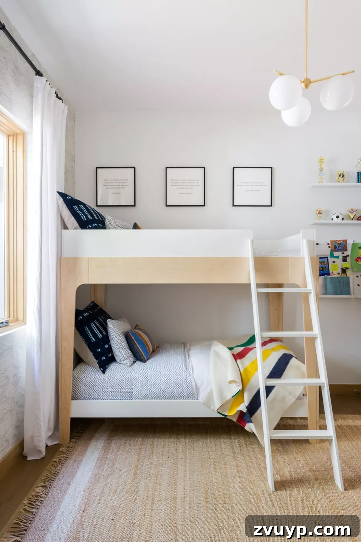 Smart Bunk Beds to Maximize Small Bedrooms 19 Modern bunk beds with clean lines and simple decor, complemented by a striking modern light fixture, perfect for a sleek and contemporary room.