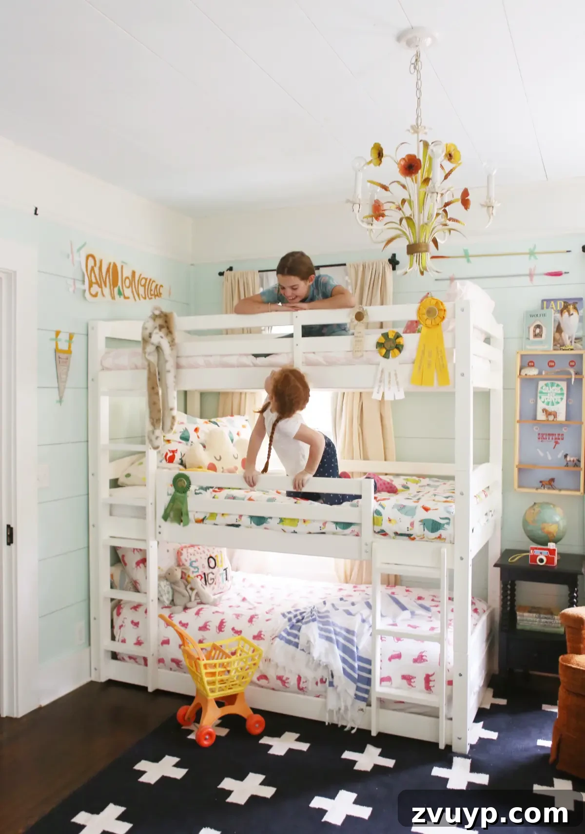 Smart Bunk Beds to Maximize Small Bedrooms 3 White triple bunk bed with eclectic cottage style decorations and equestrian ribbons for personalized charm in a child's room.