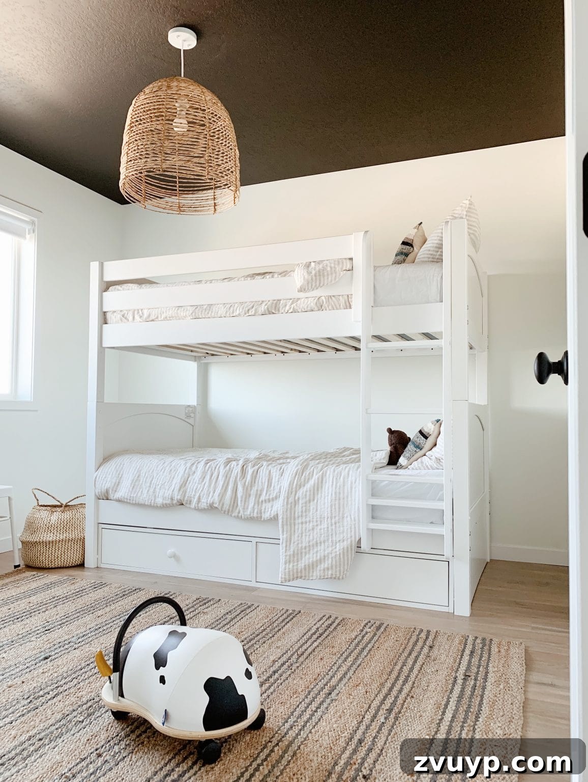 Smart Bunk Beds to Maximize Small Bedrooms 4 Gender-neutral minimalist bunk bed design enhancing space and function in a small room with clean white aesthetics and simple bedding.