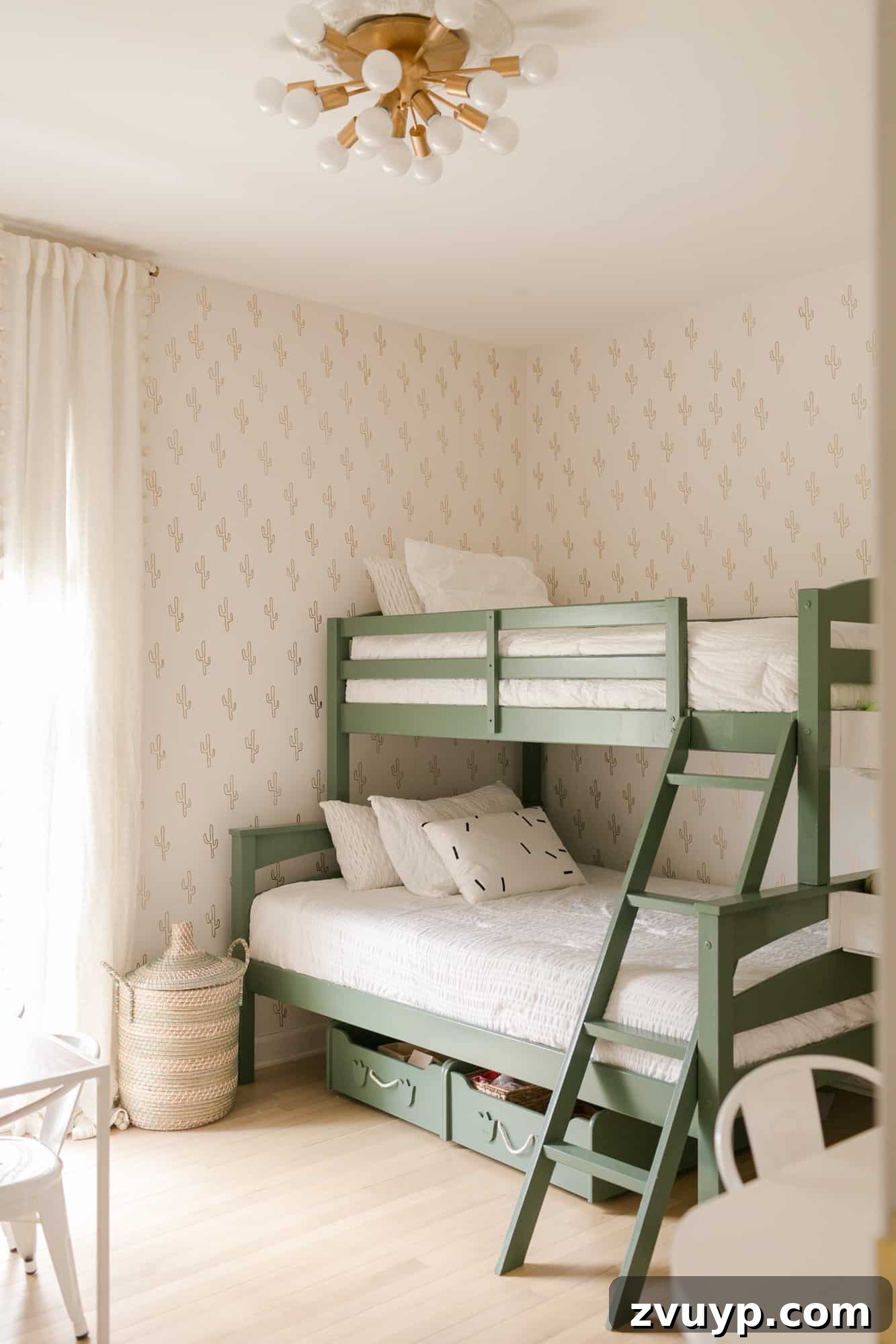 Smart Bunk Beds to Maximize Small Bedrooms 5 Gender-neutral shared bedroom featuring a twin-over-full bunk bed painted a vibrant green, adding a playful color pop and a unique cactus wall.