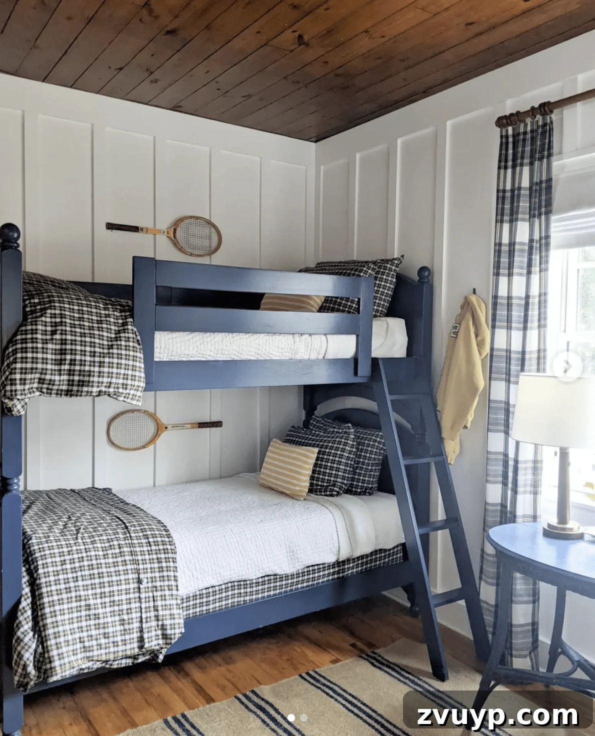 Smart Bunk Beds to Maximize Small Bedrooms 9 Rustic boys' shared bedroom featuring a wood ceiling, board and batten walls, and cozy plaid fabrics for a charming cabin style aesthetic.