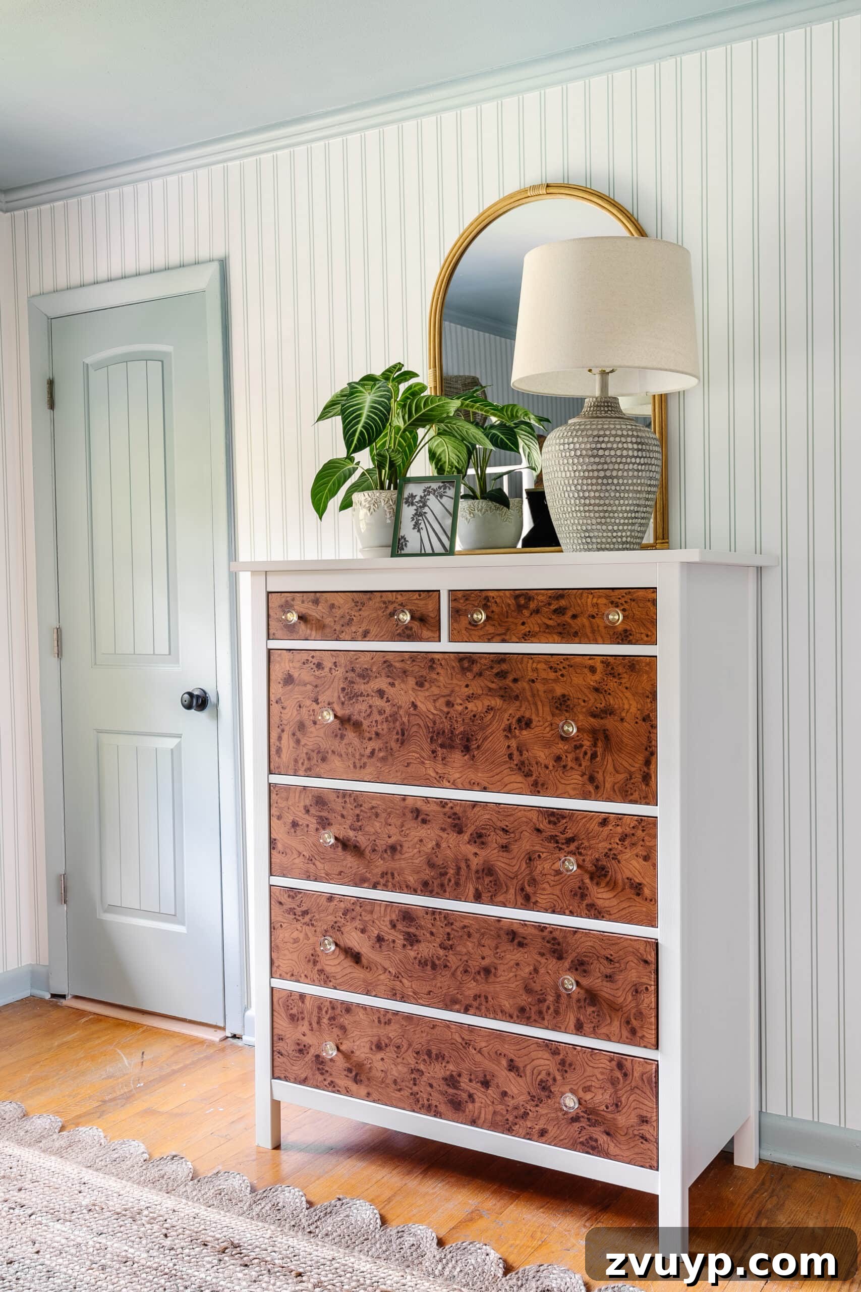 Instant Burl Wood Luxury IKEA Dresser Makeover 15 IKEA dresser hack using burl wood contact paper, striped wallpaper, blue trim, rattan mirror, and coastal table lamp