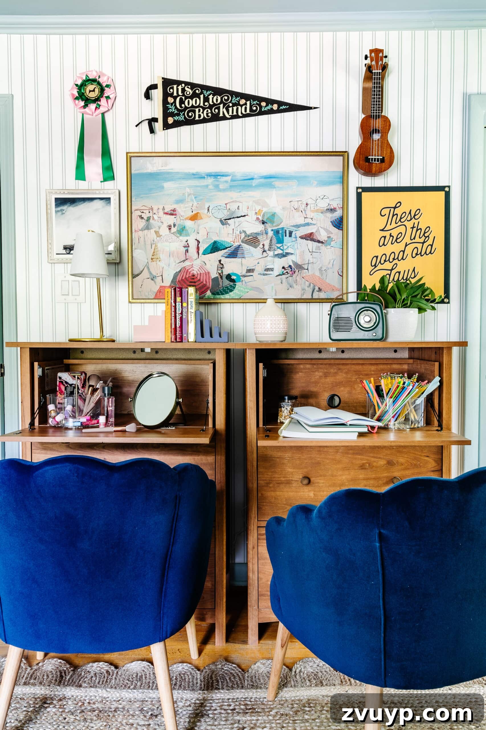 Ultimate Triple Bunk Beach Pad for Teens 15 beach bedroom gallery wall with camp art and coastal paintings behind bedroom desks