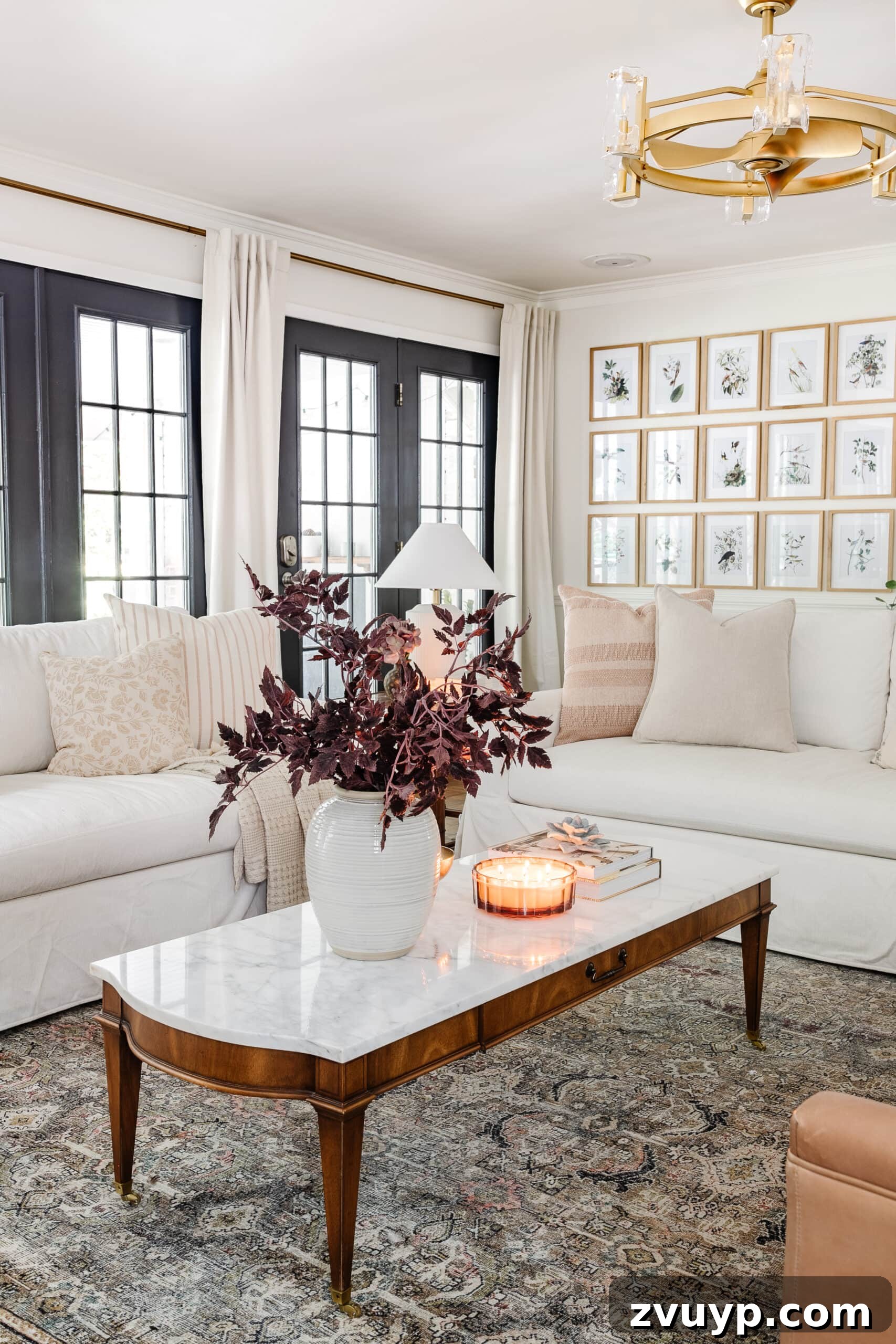 16 Natural Secrets for an Exquisitely Scented Home 3 living room decorated for fall with white sofas, marble coffee table, and rug