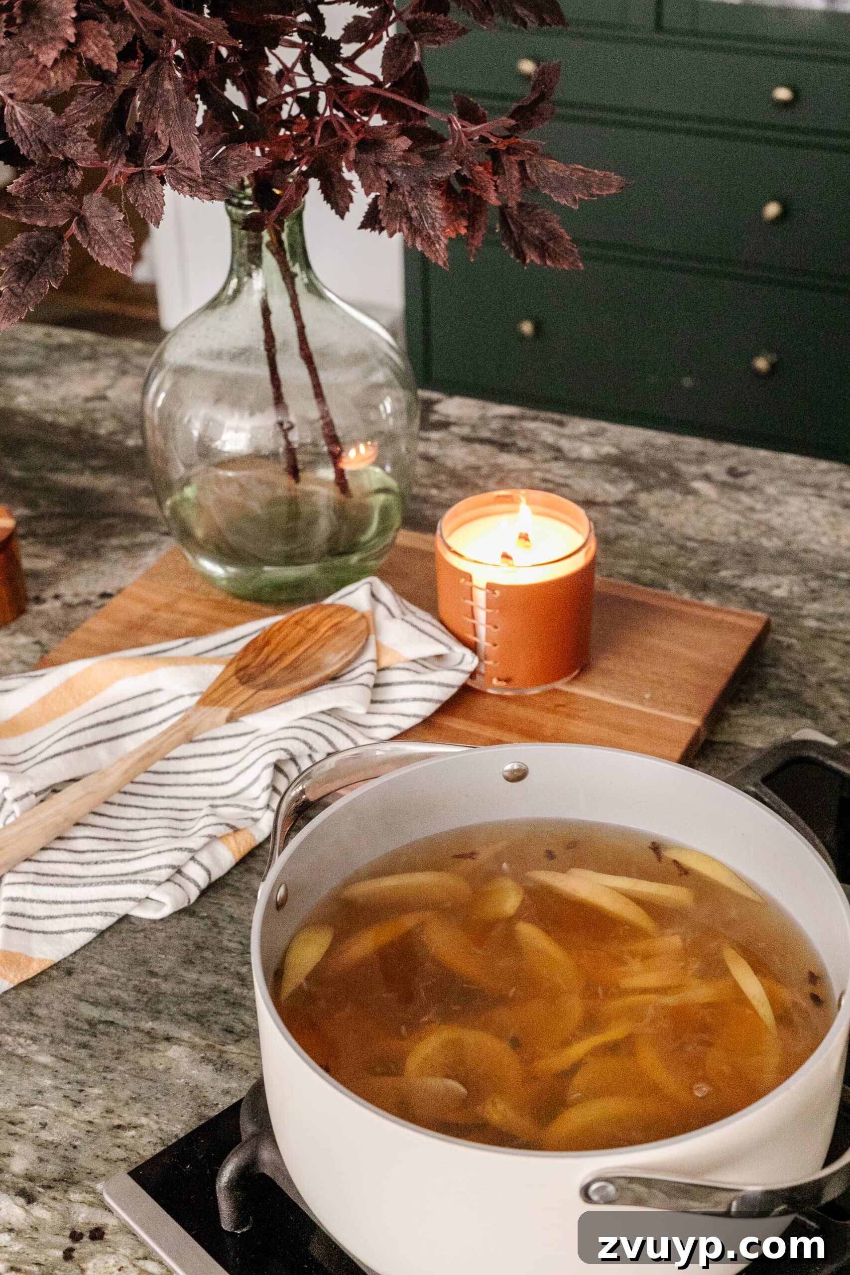 16 Natural Secrets for an Exquisitely Scented Home 6 stovetop potpourri with vase of fall leaves to make your house smell good naturally