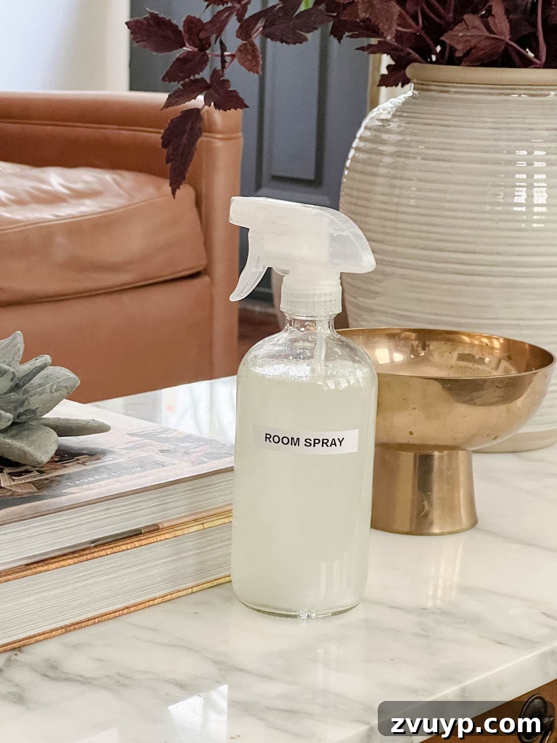 16 Natural Secrets for an Exquisitely Scented Home 7 spray bottle of room spray on a living room coffee table