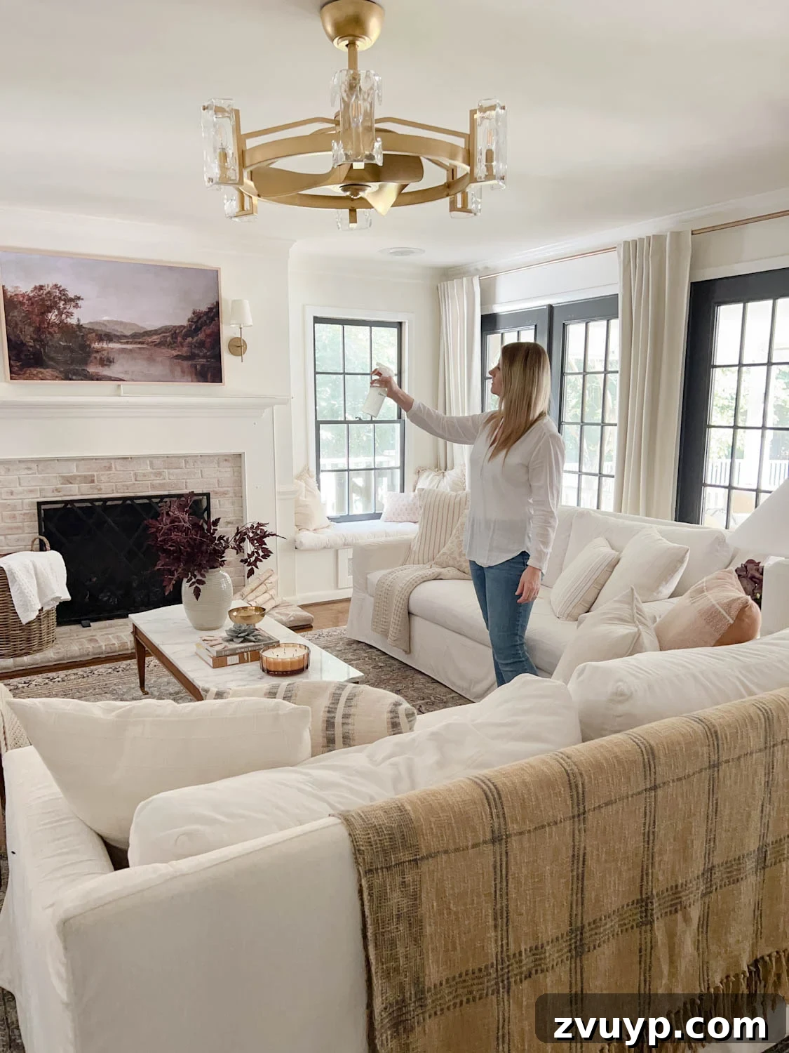 16 Natural Secrets for an Exquisitely Scented Home 9 spritzing room spray in a living room