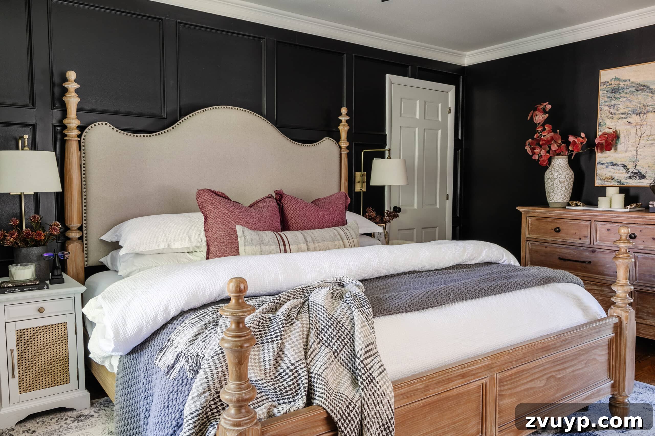 Sweet Dreams on a Budget: 10 Cozy Bedroom Tips for Ultimate Rest 3 A serene bedroom showcasing black walls, a timeless wooden bed, a classic dresser, and sumptuously comfortable bedding, perfect for a restful night.