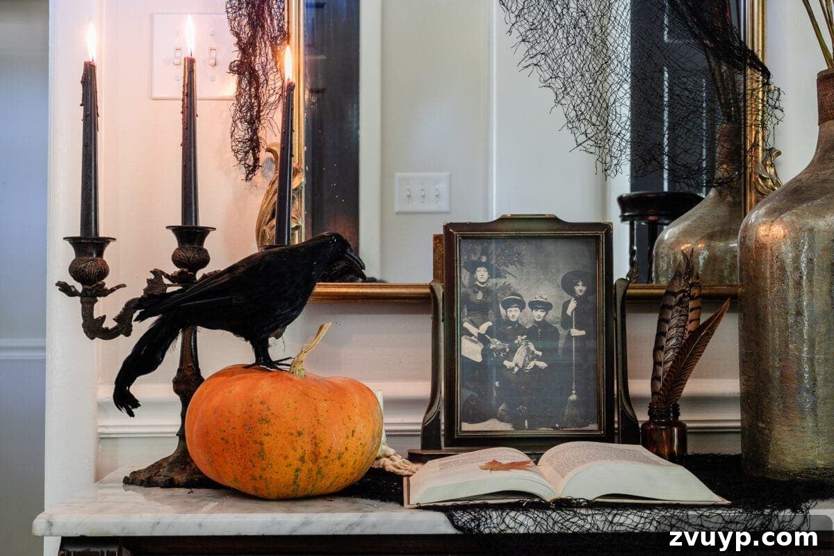 Sophisticated Scares: 30 Vintage Halloween Decor Must-Haves 8 spooky table decor with pumpkin, raven, old witch portrait, and candelabra