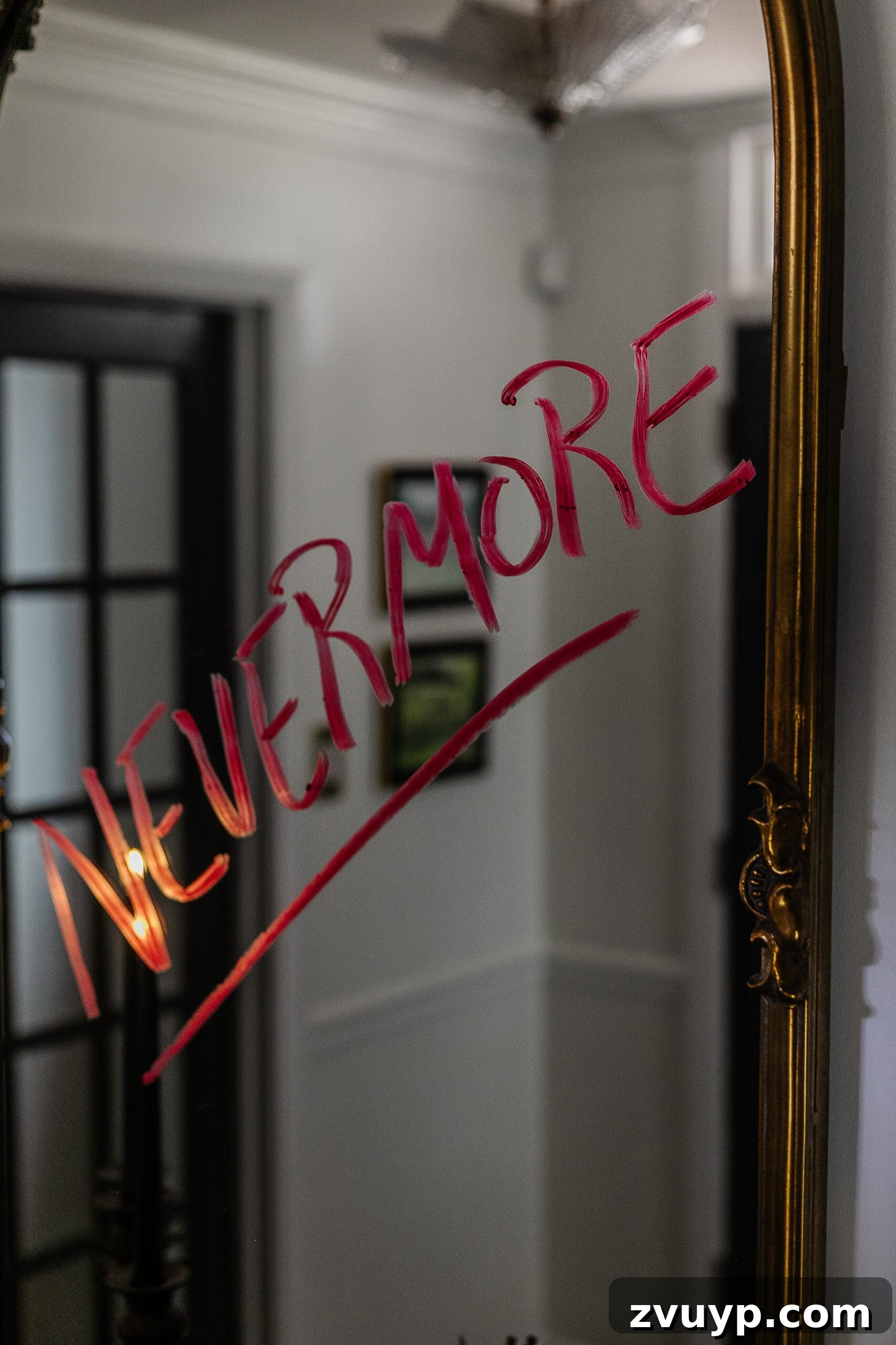 Nevermore written on mirror in red lipstick