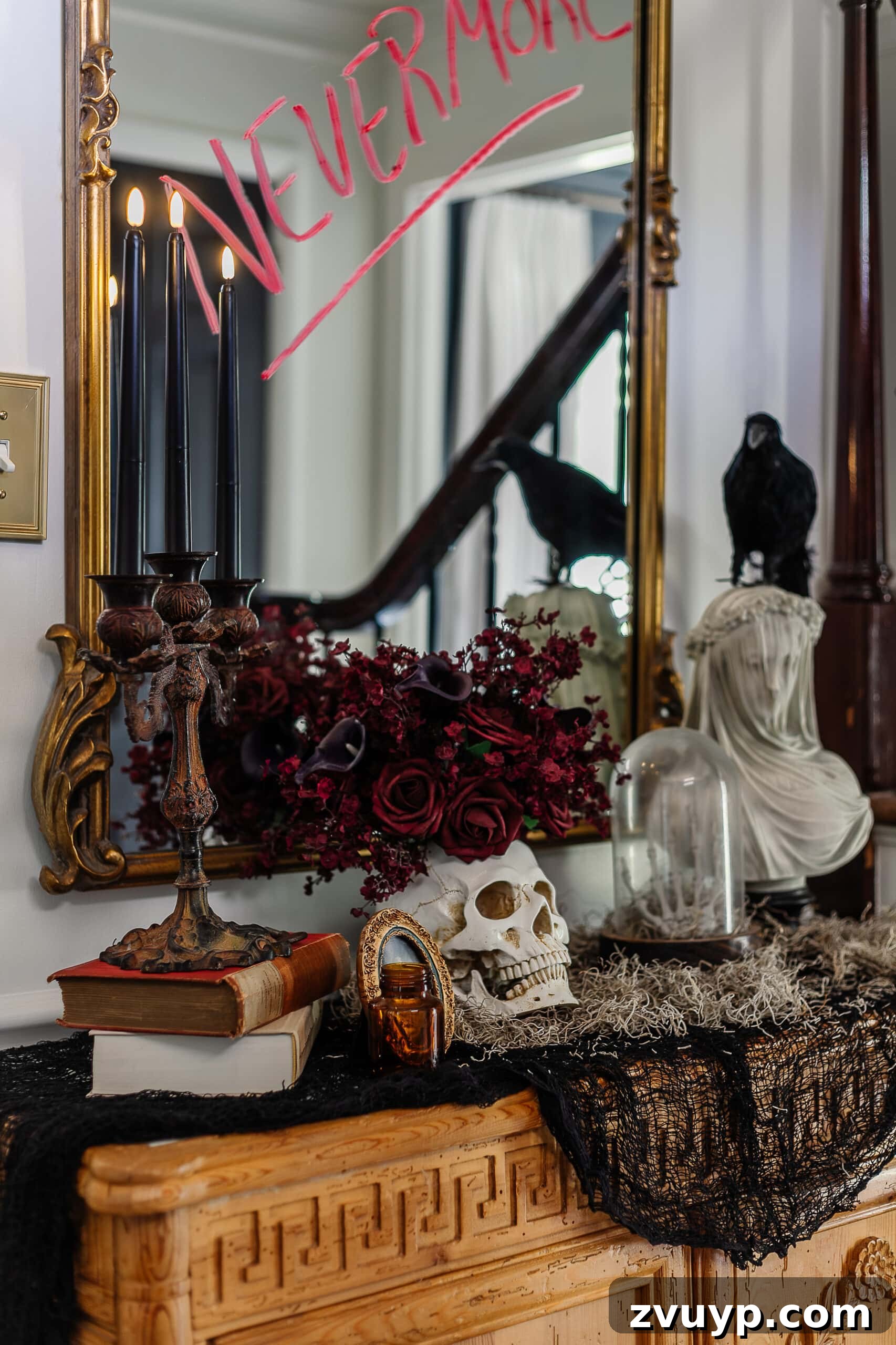 entryway table styled with DIY haunted house Halloween decor