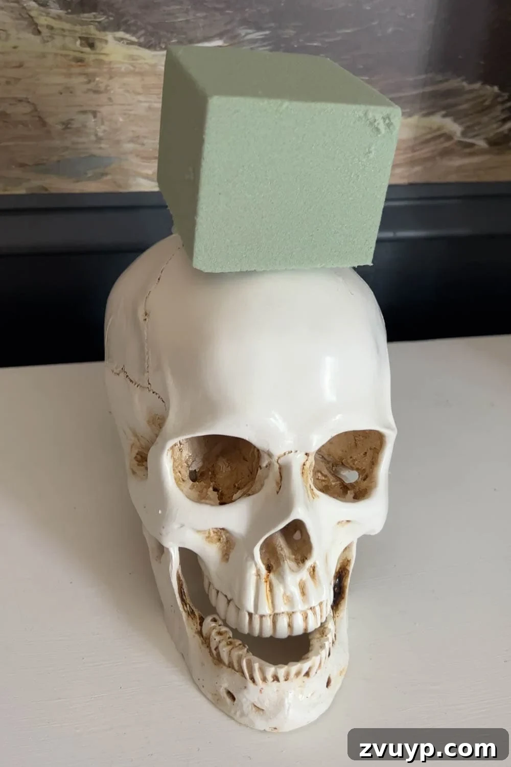 fake skull with floral block foam on top