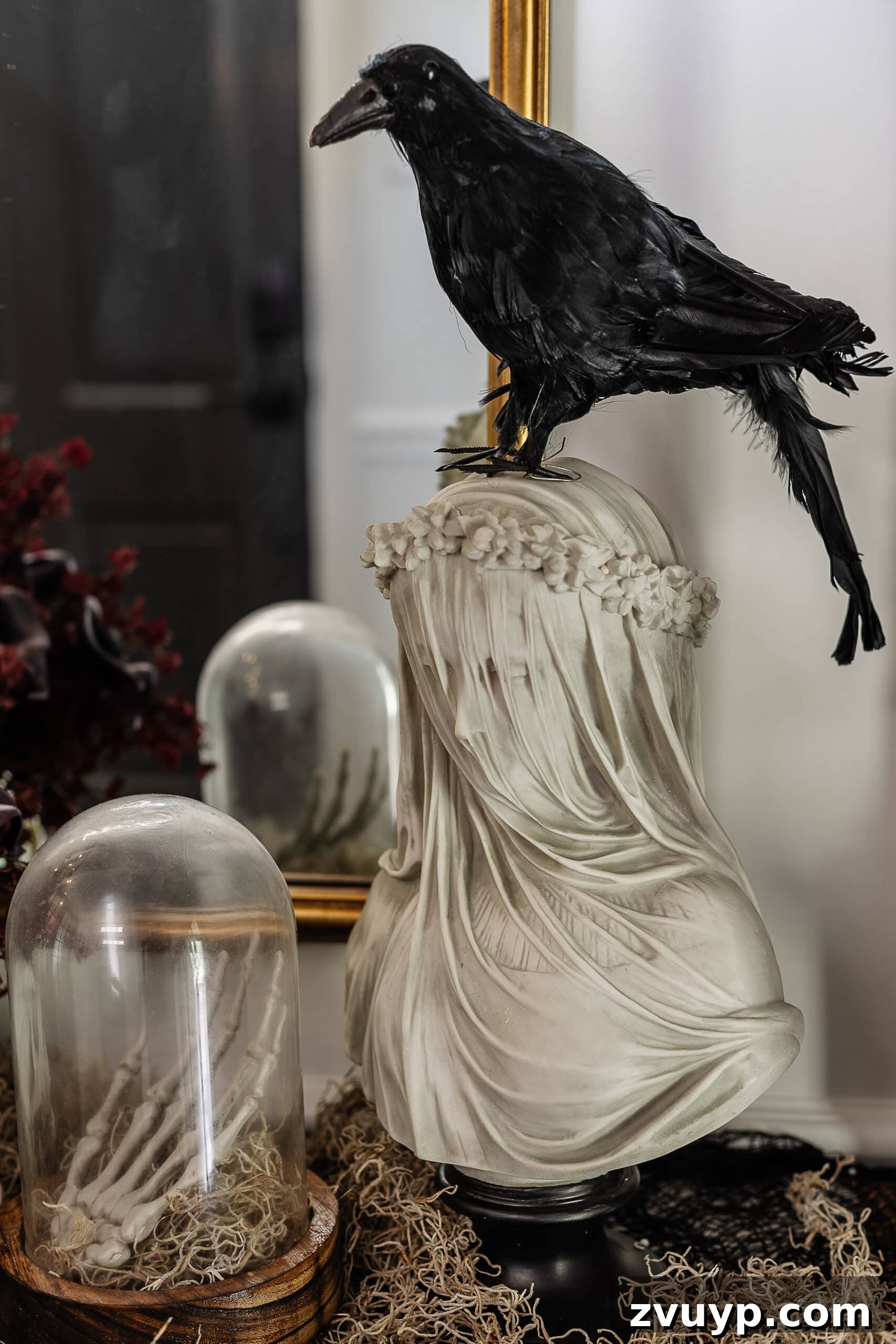 veiled statue bust with fake crow on top for DIY haunted house 