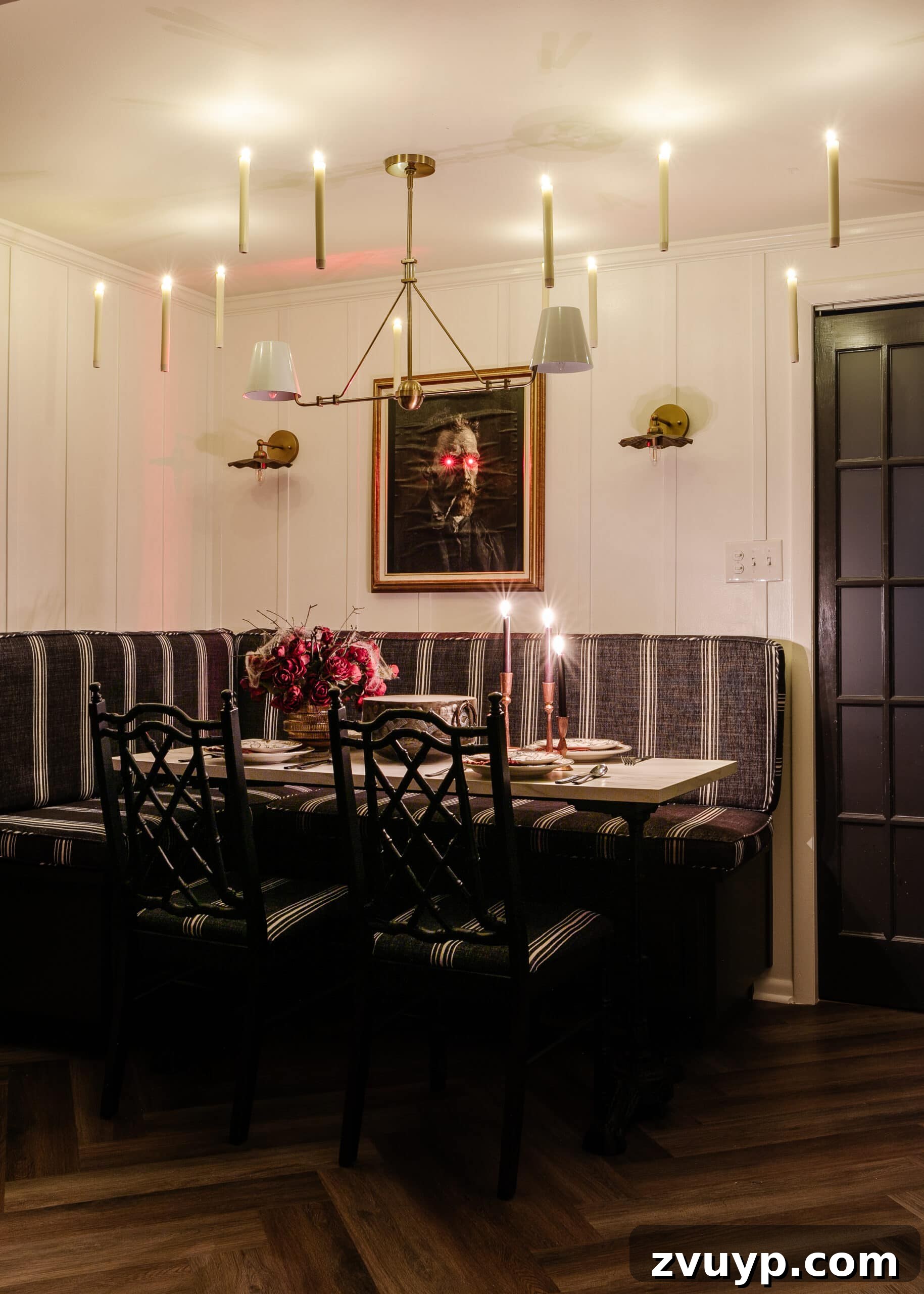 Killer Tablescapes for Your Halloween Murder Mystery 3 murder mystery dinner party with Halloween art portrait, floating candles, and dinnerware