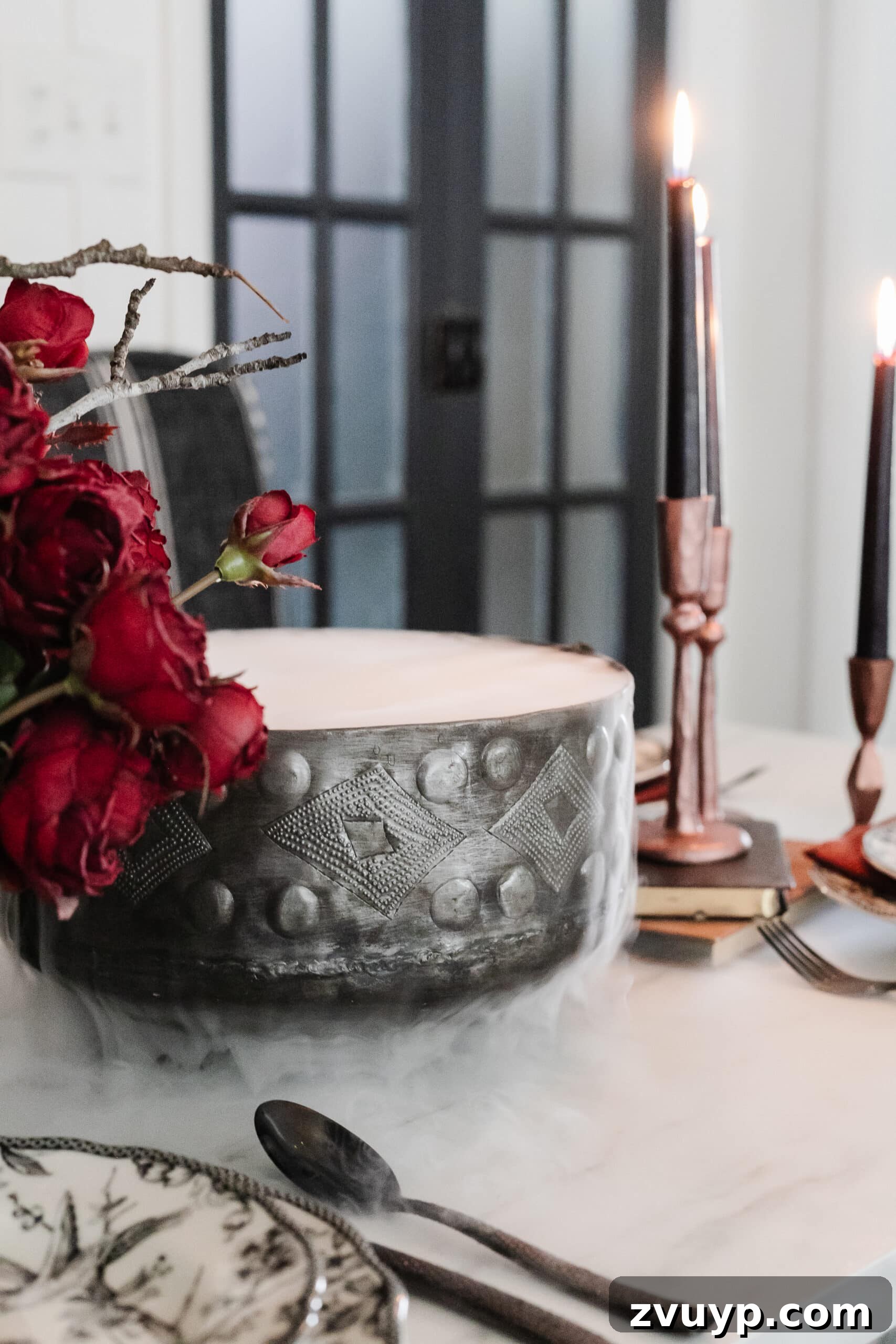 Killer Tablescapes for Your Halloween Murder Mystery 9 murder mystery dinner party simple Halloween centerpiece using a cauldron with dry ice and hot water to make fog