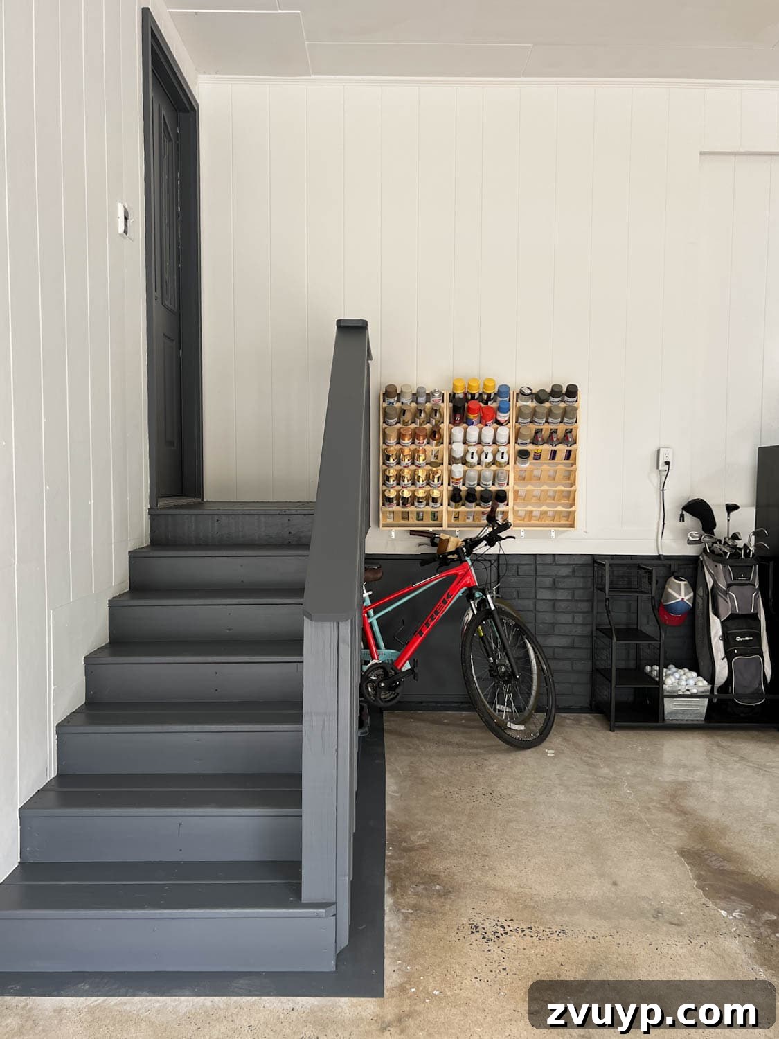Reclaim Your Garage Space with Smart Storage 14 garage makeover with paint can storage and sporting goods storage
