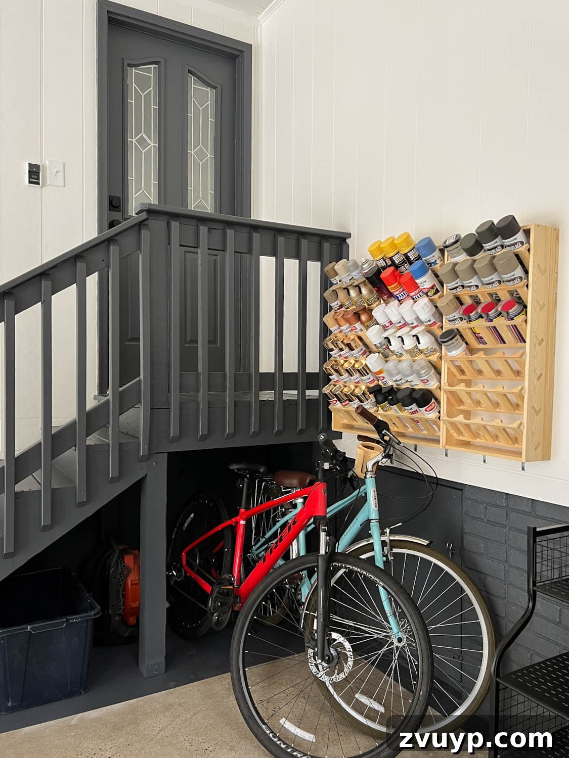 Reclaim Your Garage Space with Smart Storage 16 paint can storage rack and bikes in a garage makeover