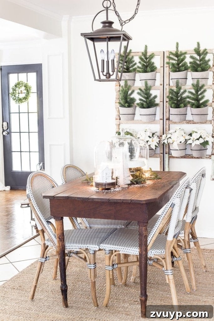 Deck Your Walls: 18 Festive Christmas Decor Ideas & Printable Holiday Art 10 A DIY wall planter adorned with mini Christmas trees and potted poinsettias, creating festive wall decor
