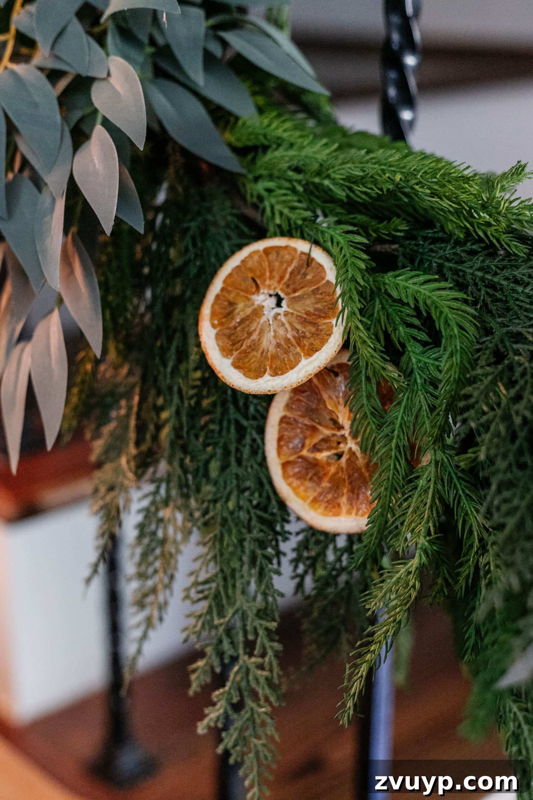 Deck the Halls Staircase and Entryway Christmas Garland Decor 10 dried orange slices added to Christmas garland on stairs