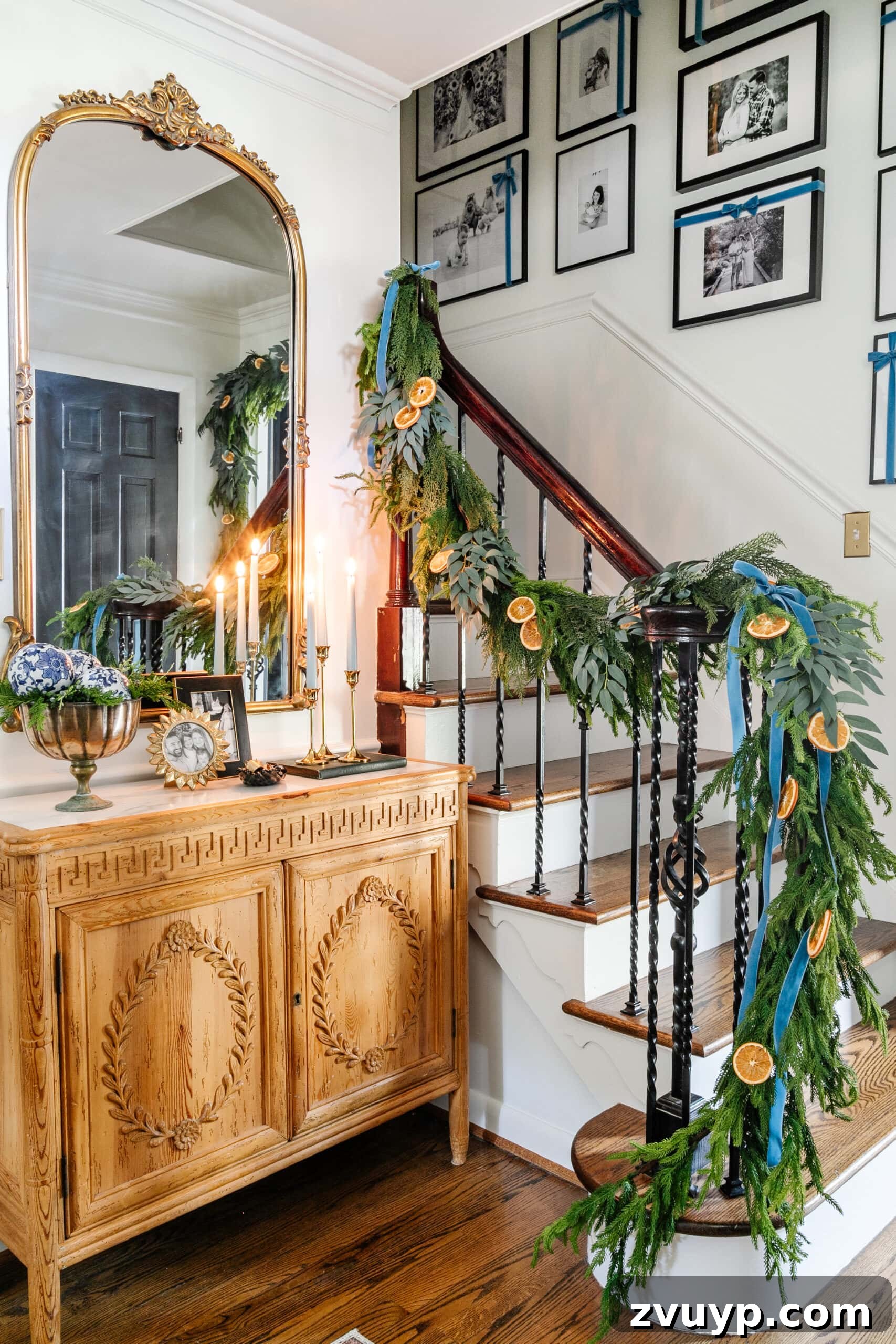 Deck the Halls Staircase and Entryway Christmas Garland Decor 15 blue entryway Christmas decor with ribbon hanging from garland on stairs