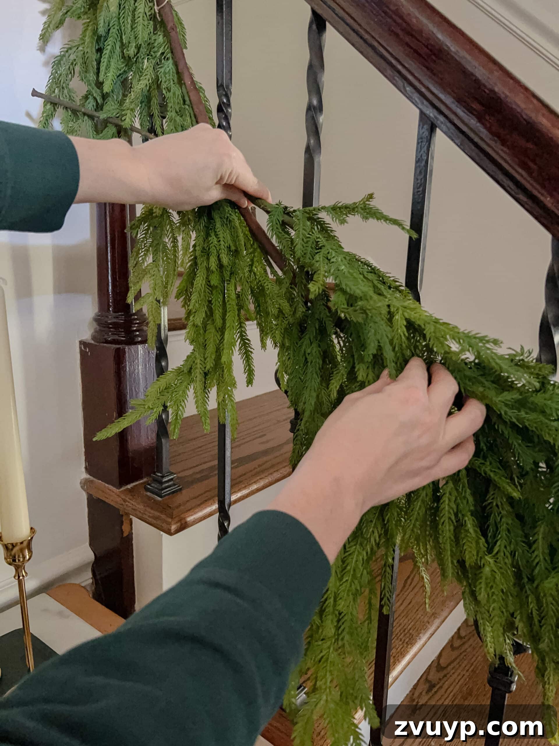 Deck the Halls Staircase and Entryway Christmas Garland Decor 8 adding stems to garland to make it appear more full