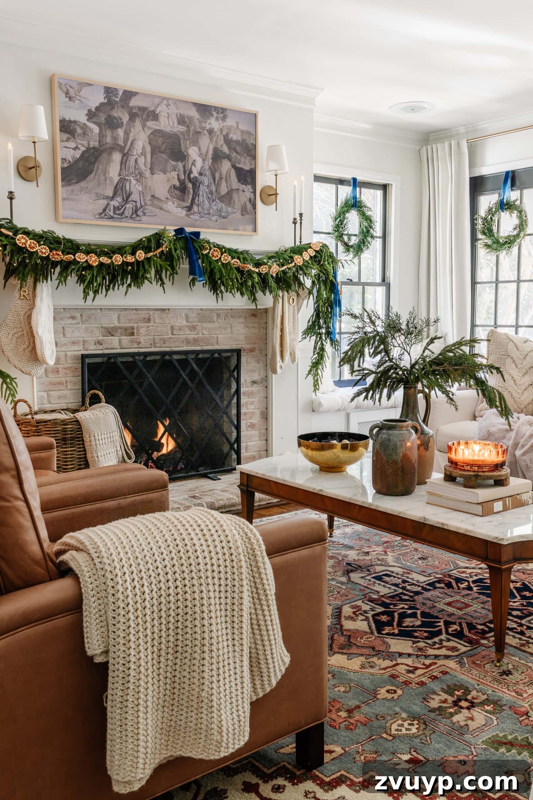 Festive Comfort: Living Room Decor for a Magical Christmas 5 A soft, sweater knit blanket draped over a rich leather chair, contributing to a cozy Christmas living room aesthetic.