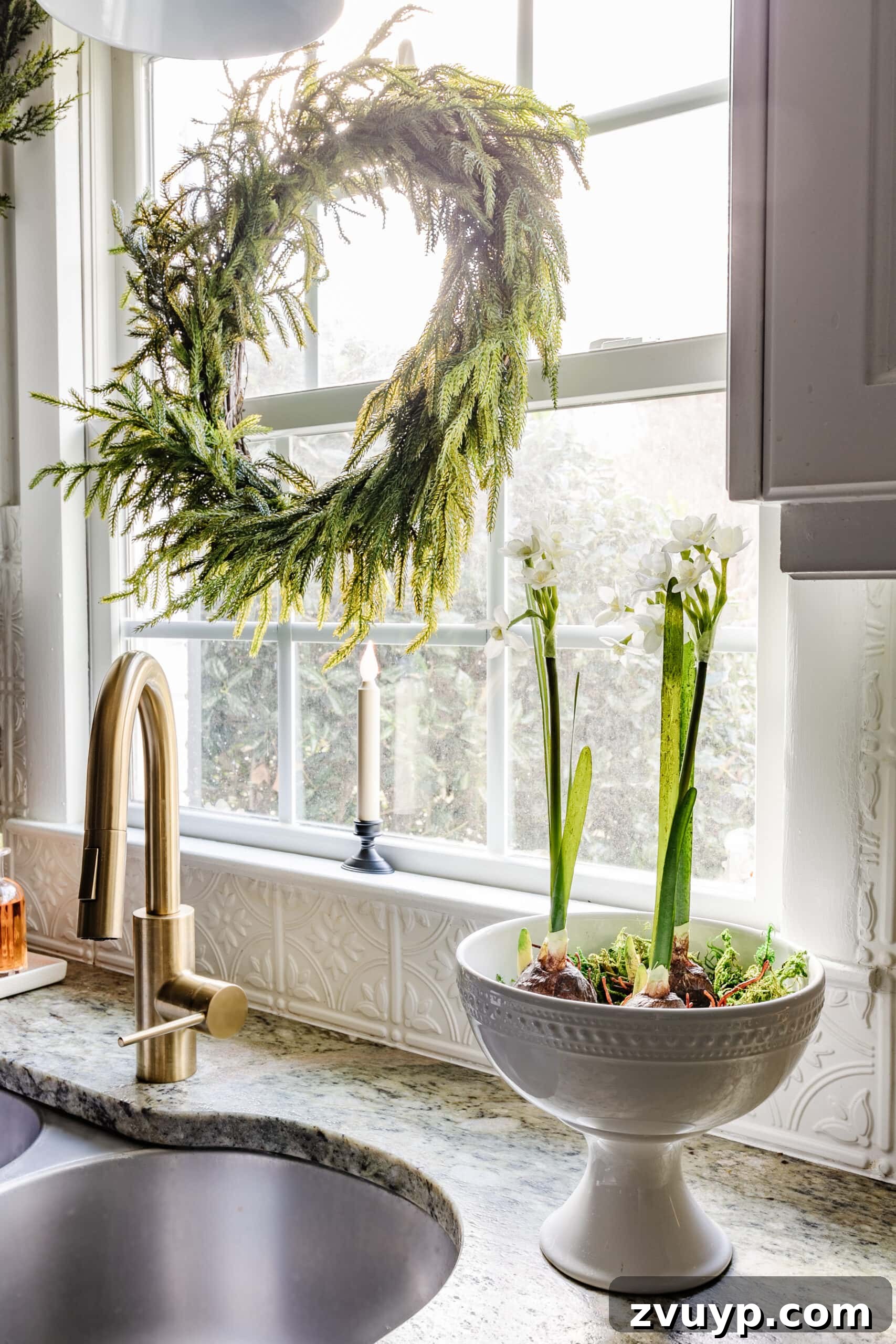 9 Quick Christmas Kitchen Transformations 7 pedestal bowl of paperwhite flowers beside a kitchen sink for holiday decor